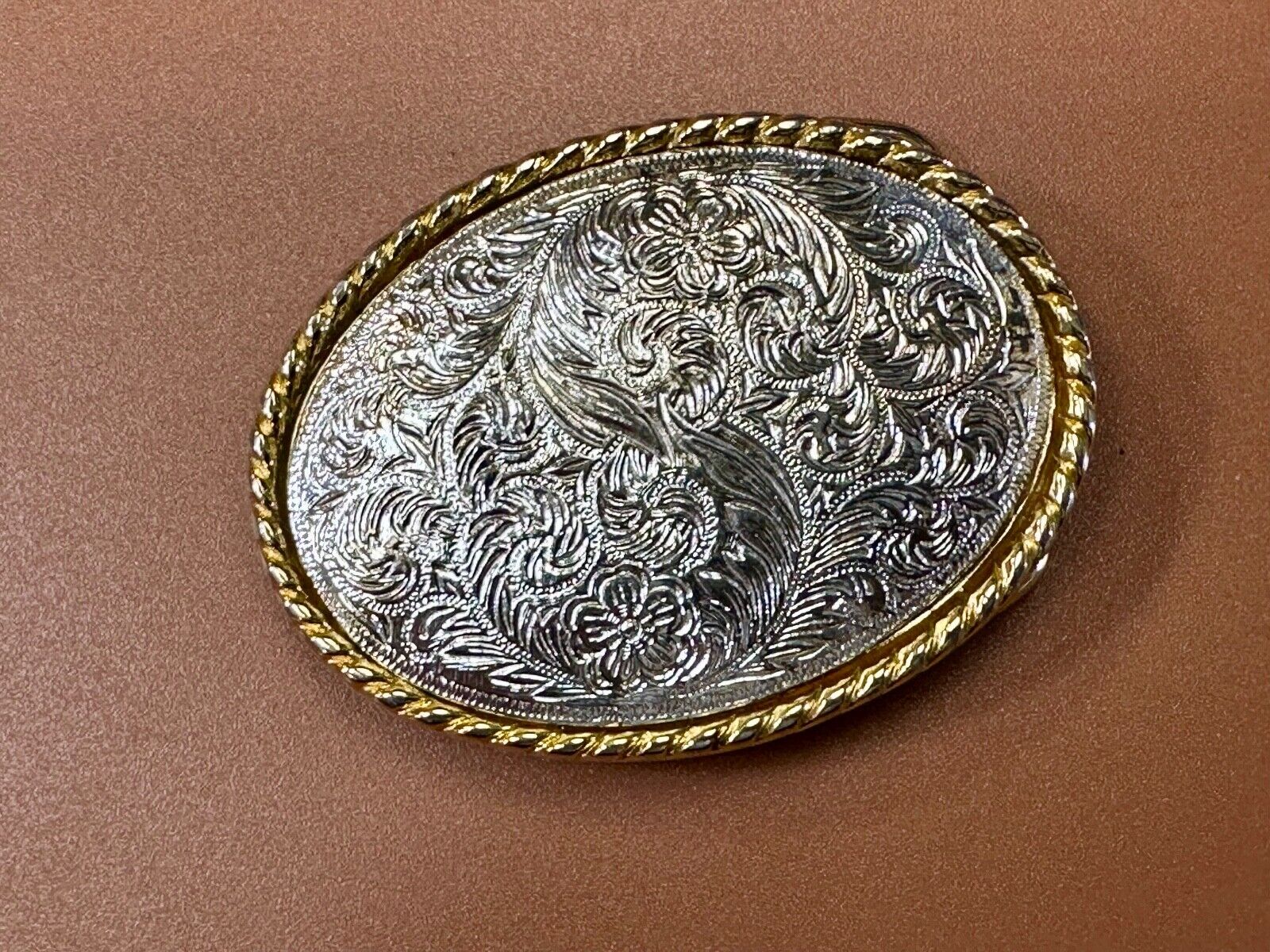 vintage Ivan Brand western flower swirl design two tone oval belt buckle