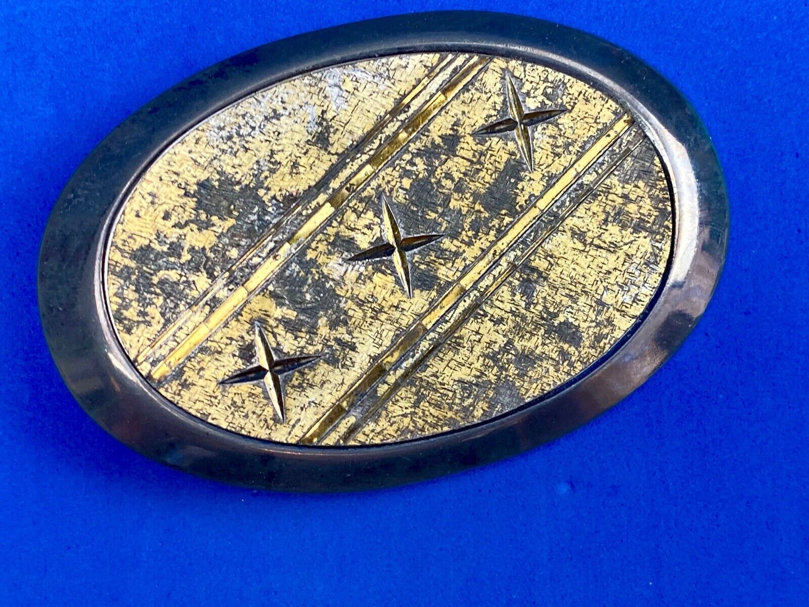 Unique XXX gold tone belt buckle tic tac toe pattern