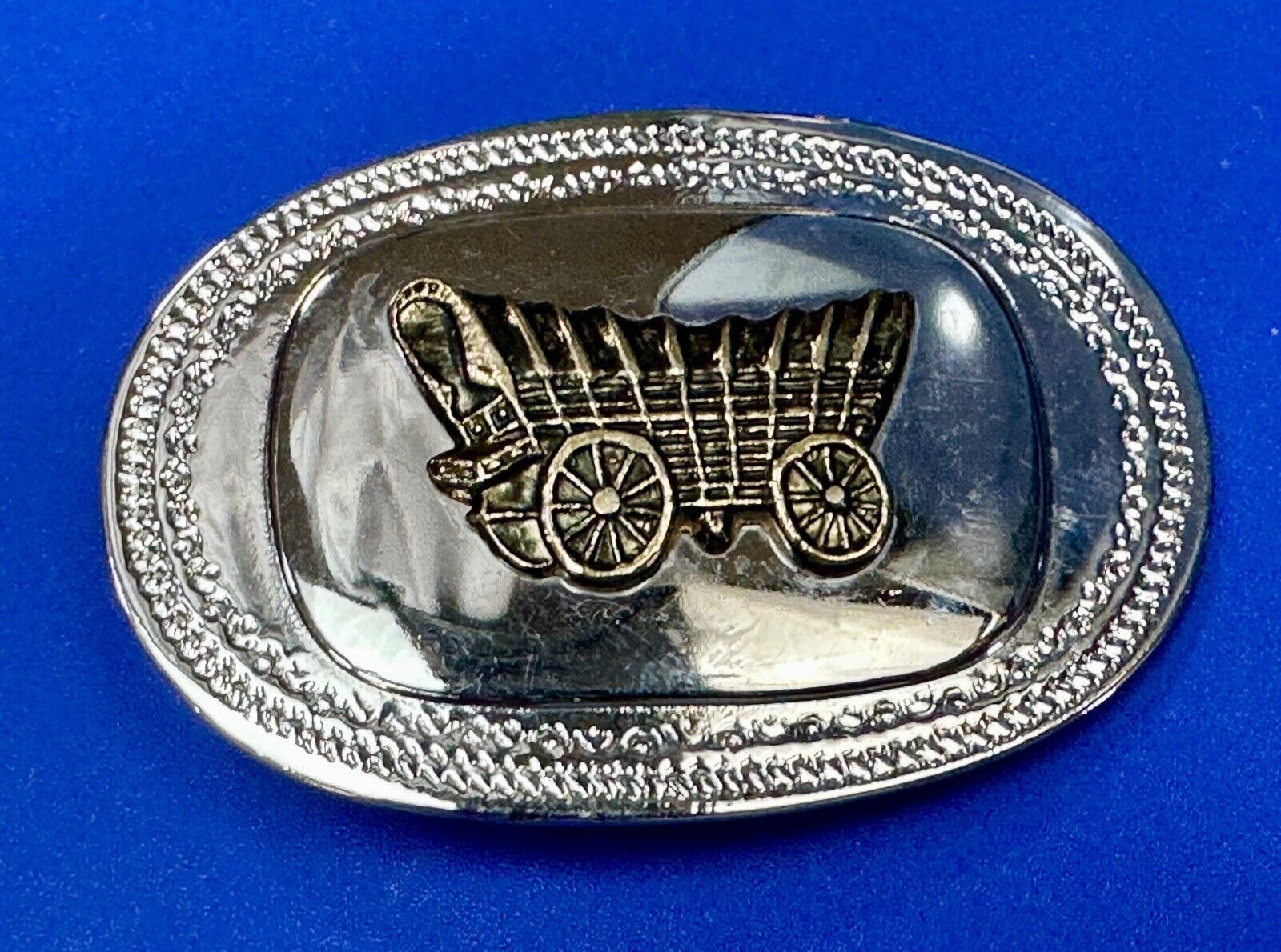 70s Covered Wagon two tone reflective oval ornate boarder belt buckle