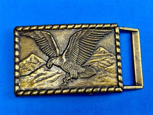 Vintage flying, hunting, fishing American eagle belt buckle with western boarder
