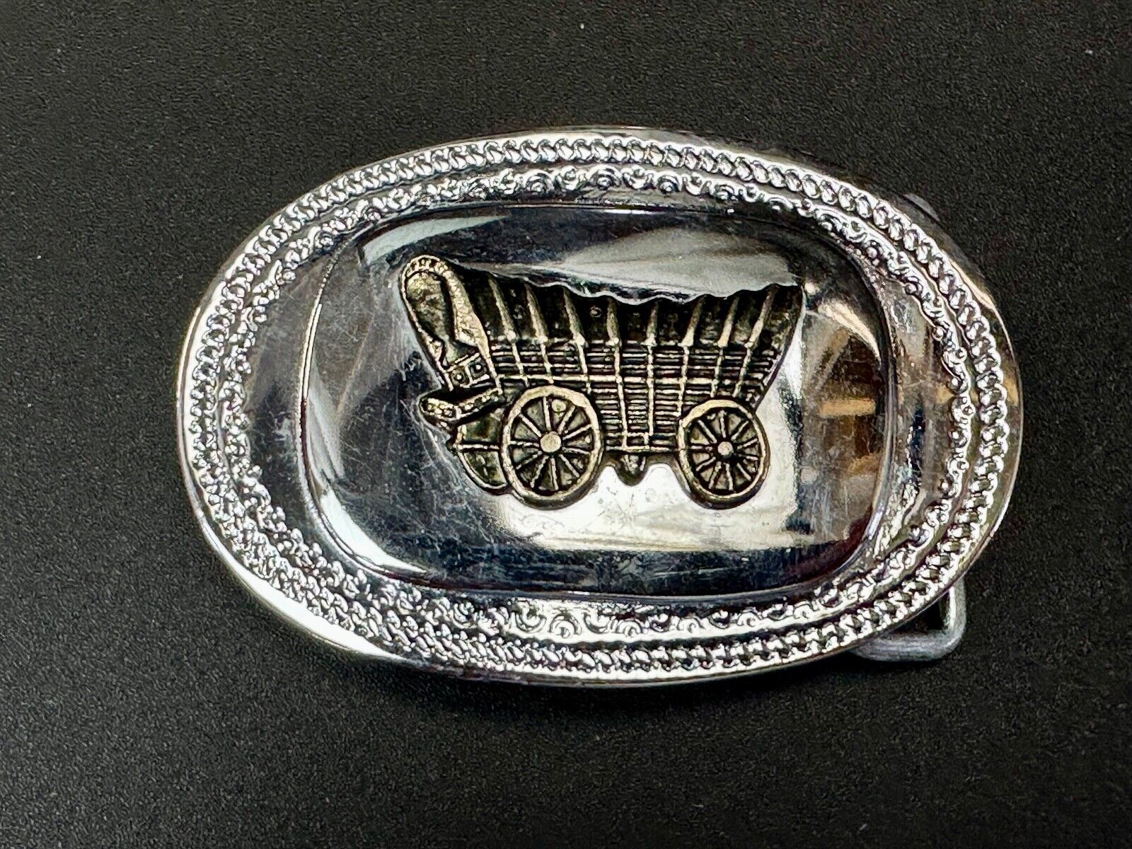 70s Covered Wagon two tone reflective oval ornate boarder belt buckle