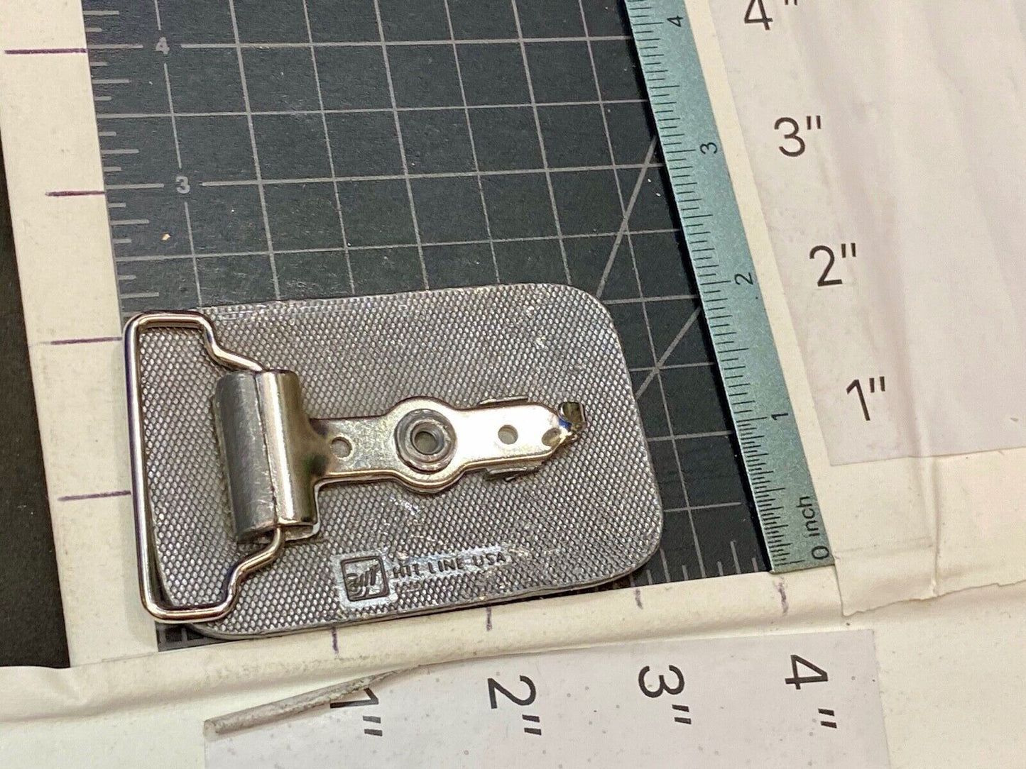 unknown to me, vintage metal belt buckle by HitLine INC.   Company Logo?