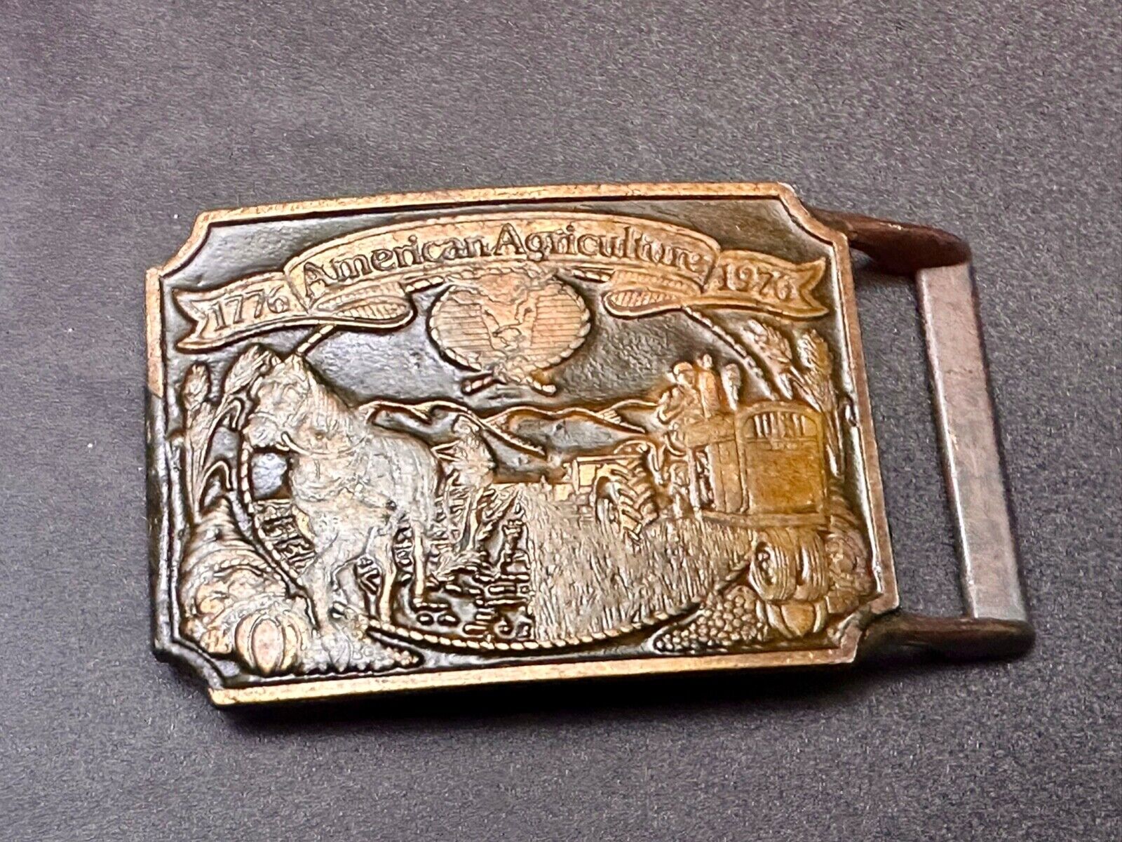 Bicentennial American Agriculture Horse to tractor,  Vtg  belt buckle by Ortho