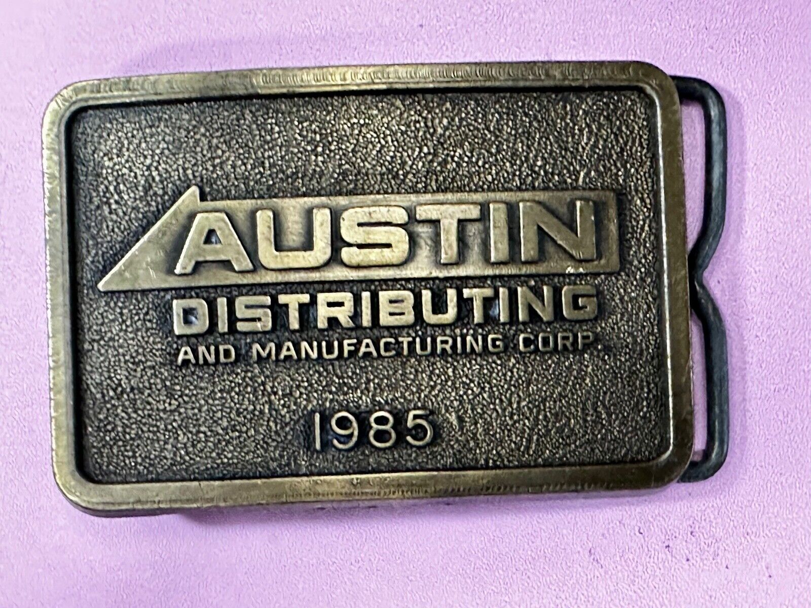 Austin Texas Distributing and Manufacturing 1985 Advertisement Promo Belt Buckle