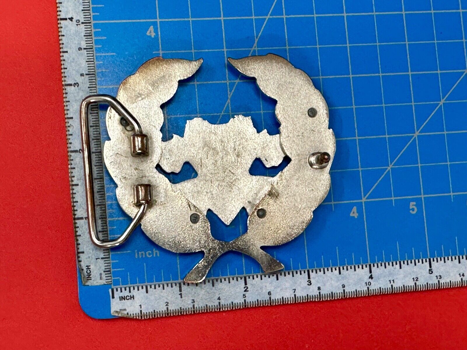Two griffins?  FME RheJNG Olive branch cutout belt buckle