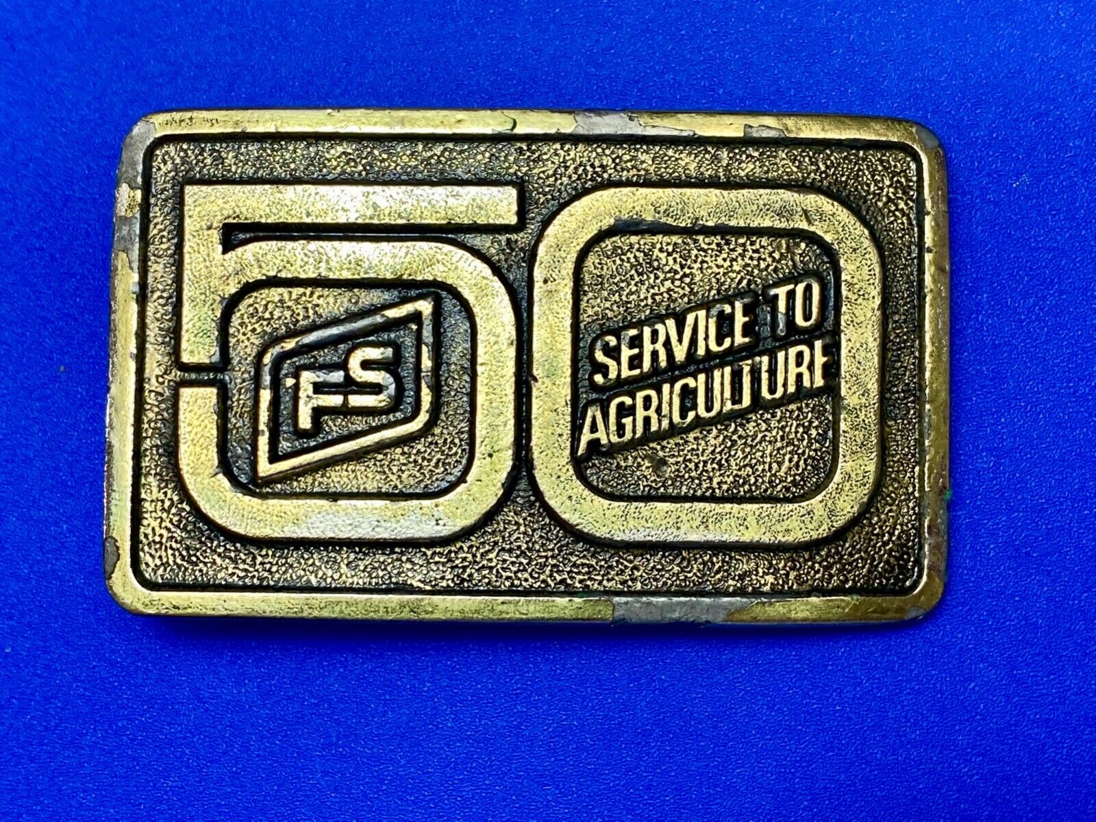 50 years, Farm Service to Agriculture belt buckle by Wyoming Studio Art works