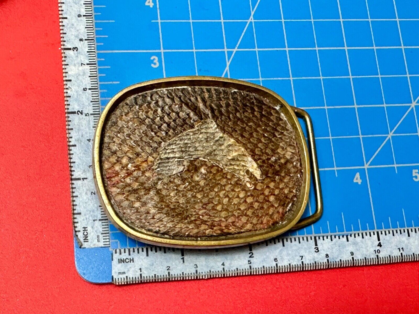 Artisan jumping fish on snake skin solid brass belt buckle