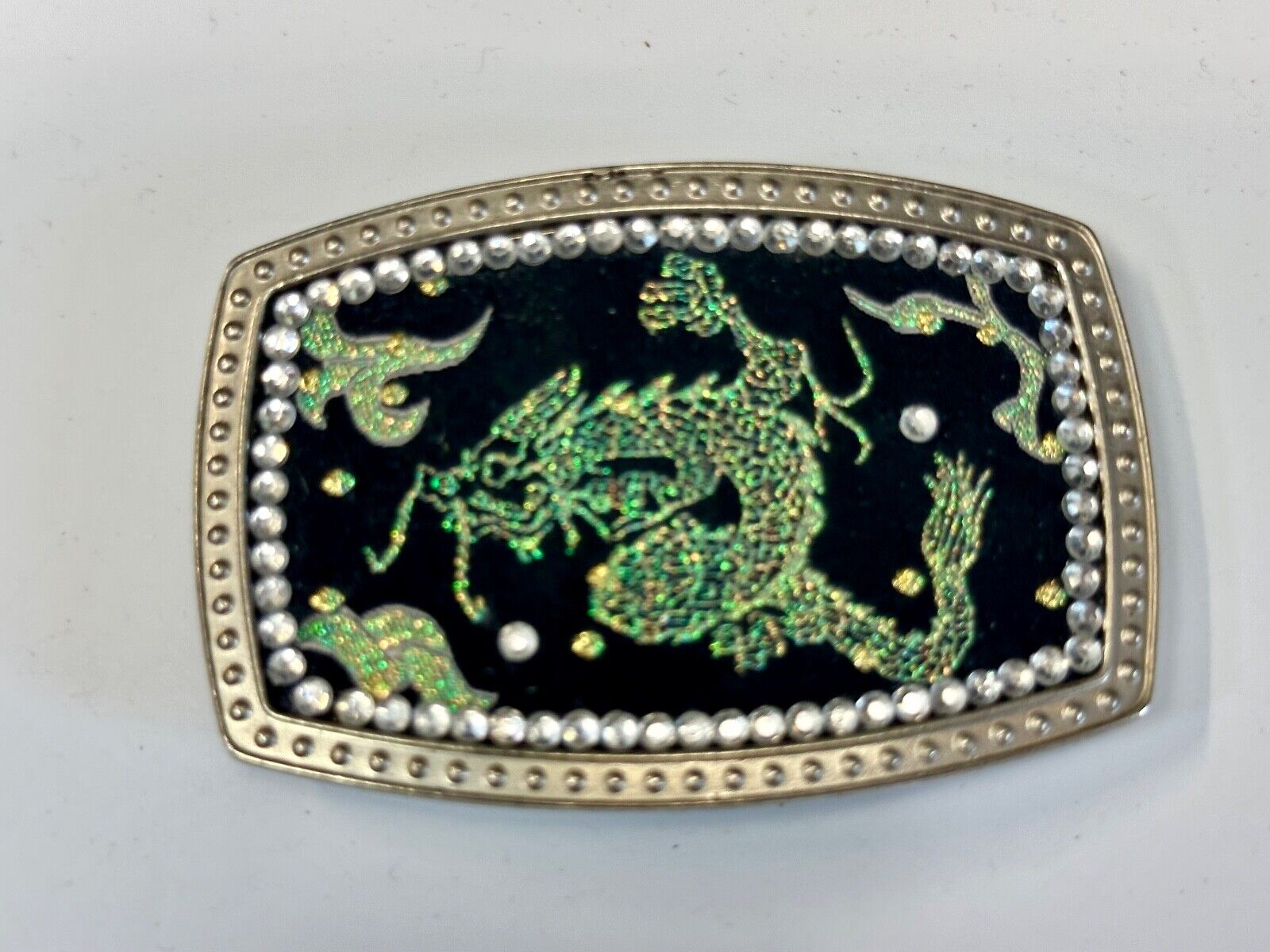 Chinese Dragon pattern symbol on silver tone rhinestone accented belt buckle