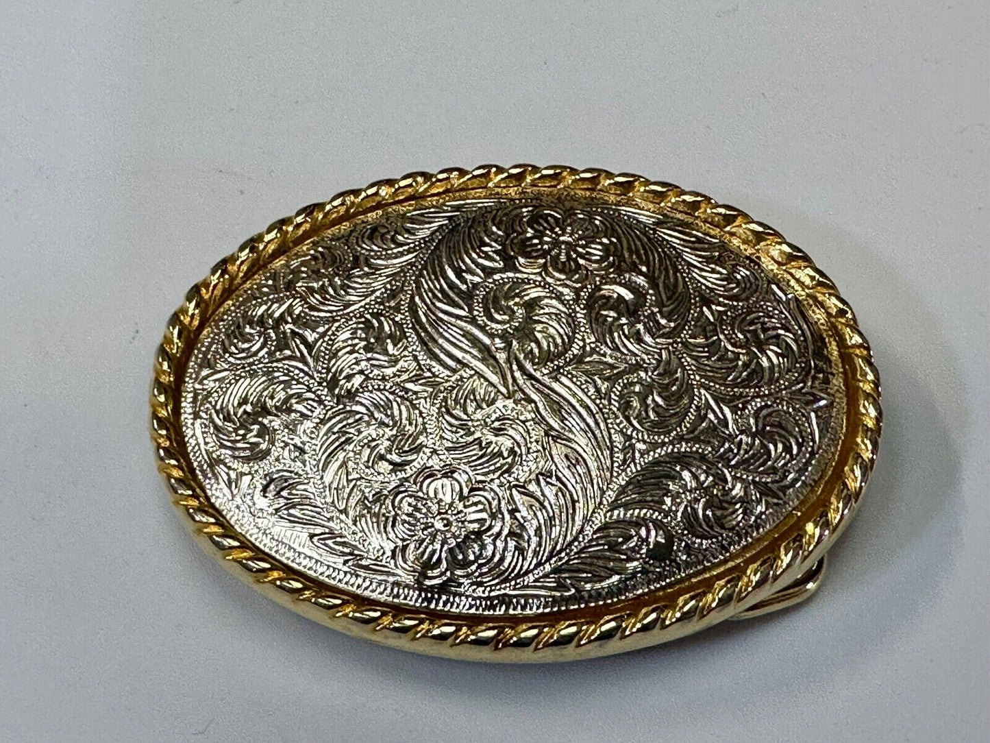 vintage Ivan Brand western flower swirl design two tone oval belt buckle