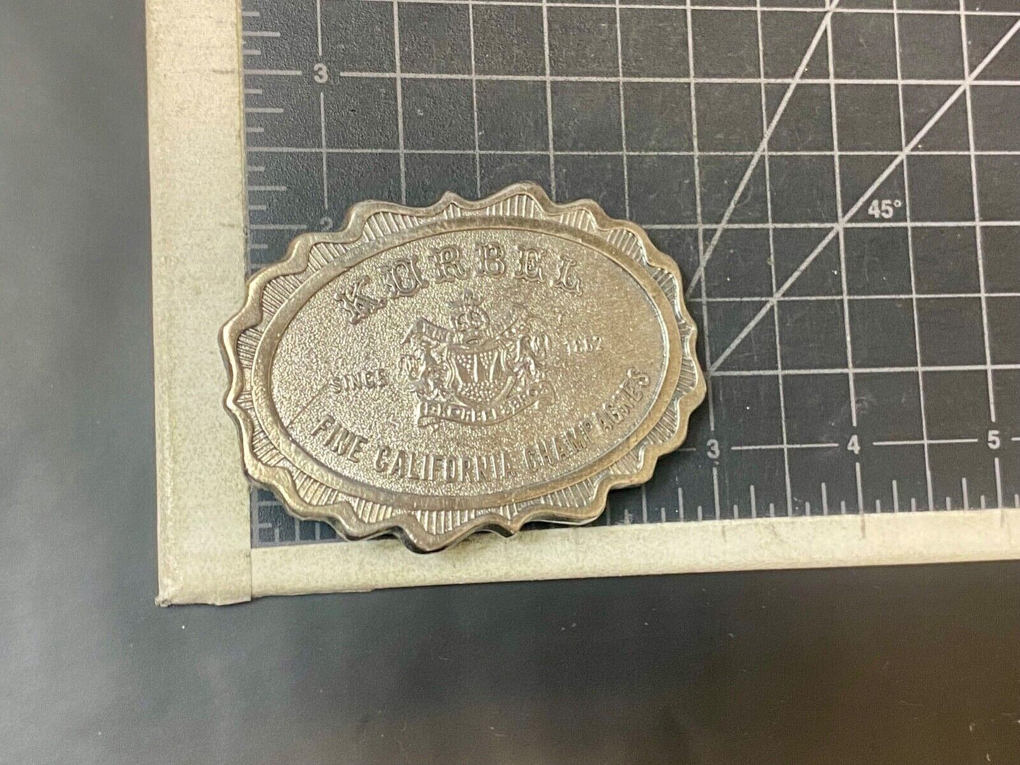 vintage Korbel Fine California champagne belt buckle by Wyoming Studio Art