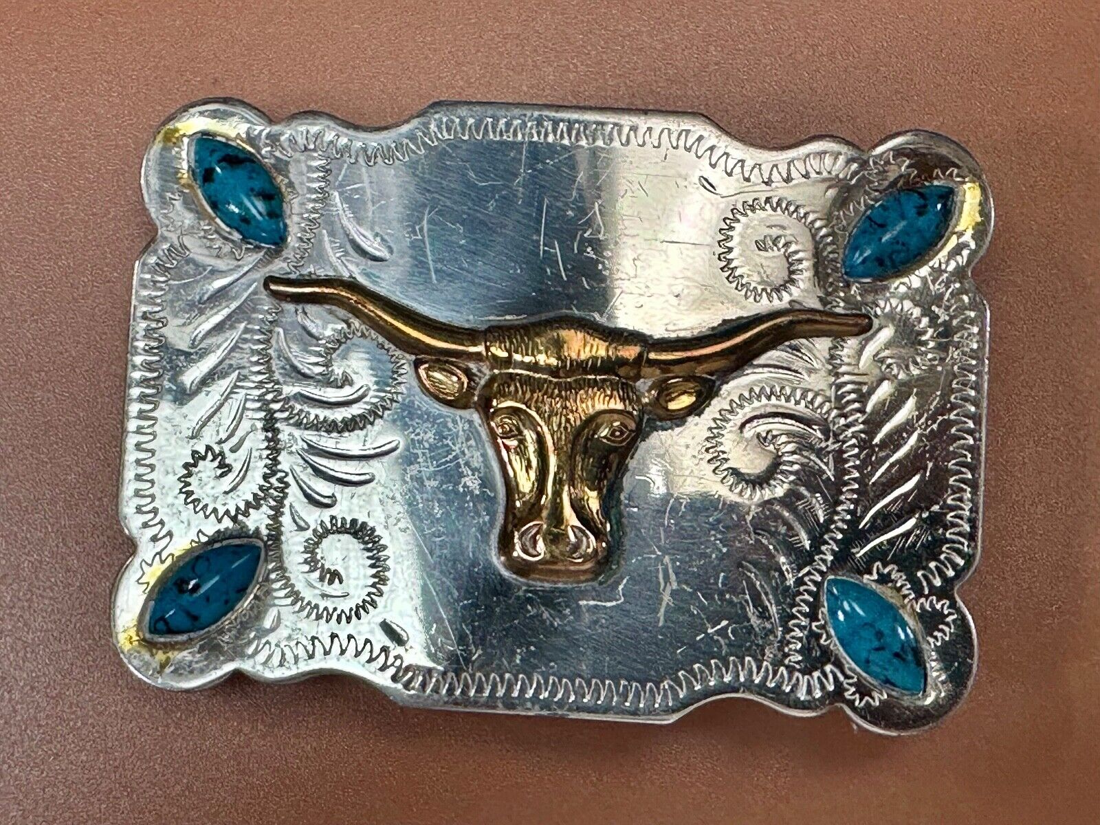 The Longhorn cow steer western nickel silver belt buckle with turquoise accents
