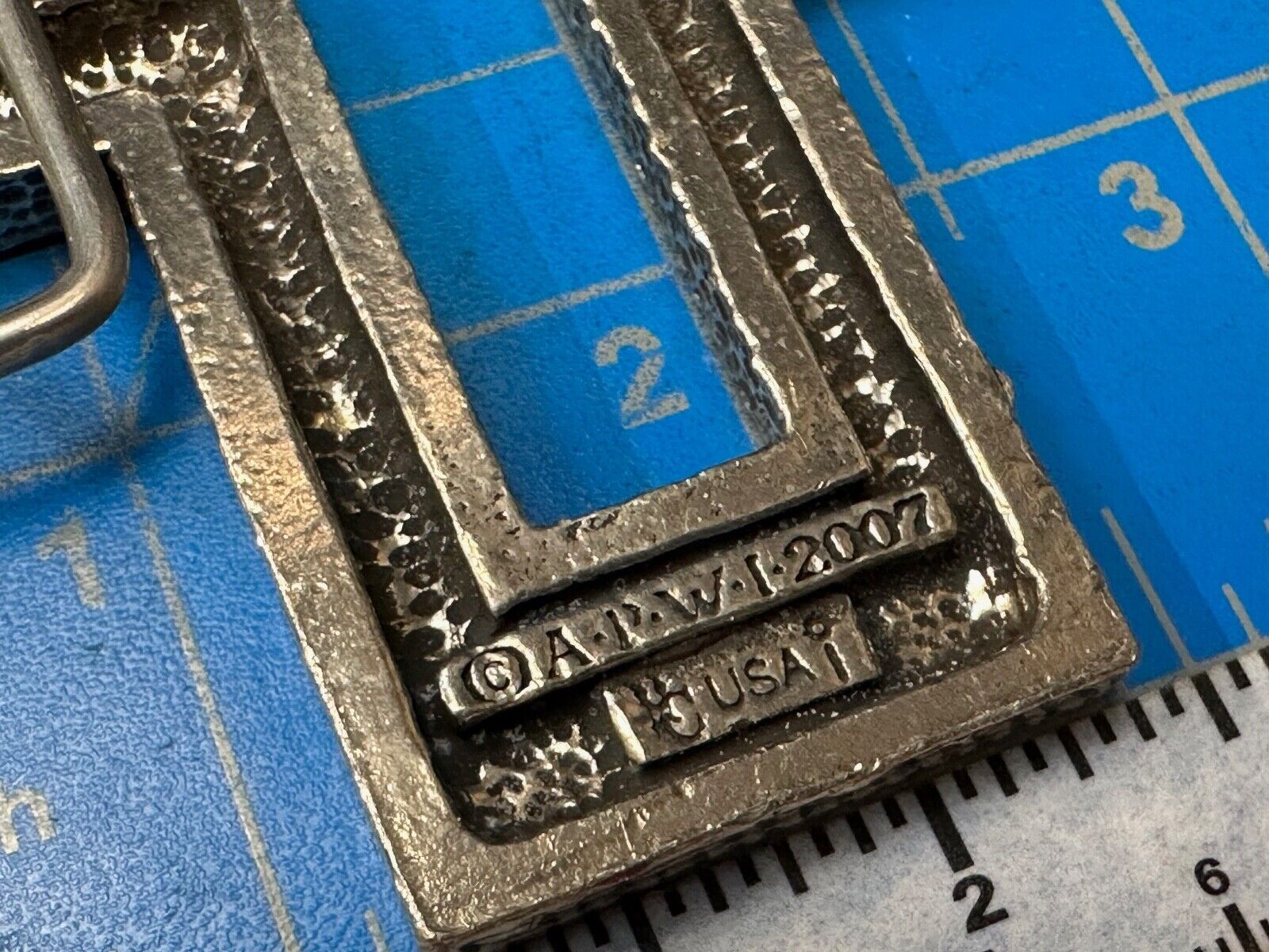 A.P.W. 2007 cross cutout silver tone belt buckle