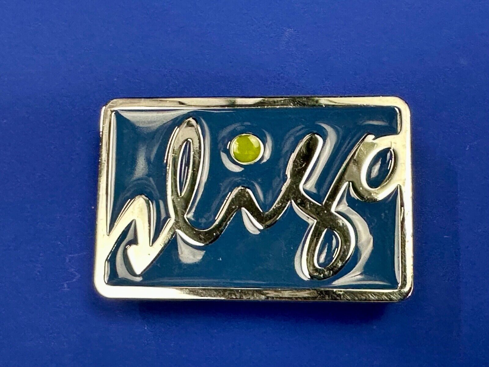 unknown to me!   Sligo Sugowear blue colored emblem or logo belt buckle