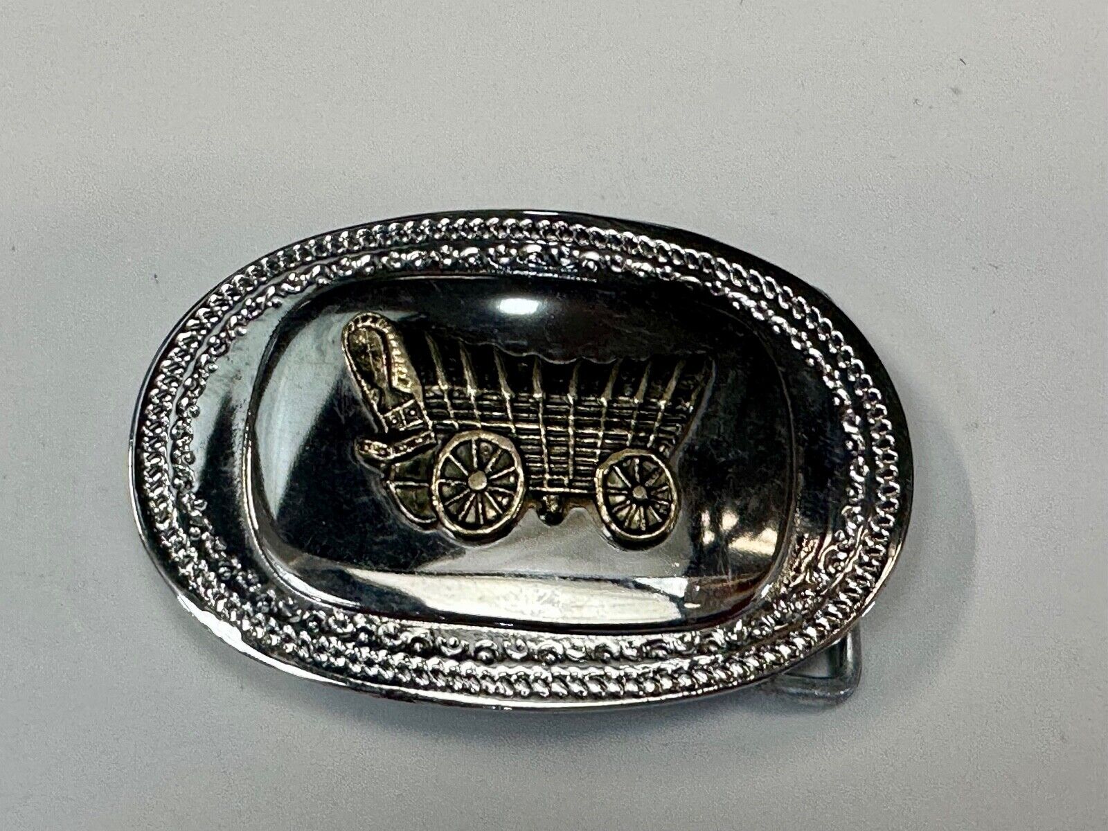 70s Covered Wagon two tone reflective oval ornate boarder belt buckle