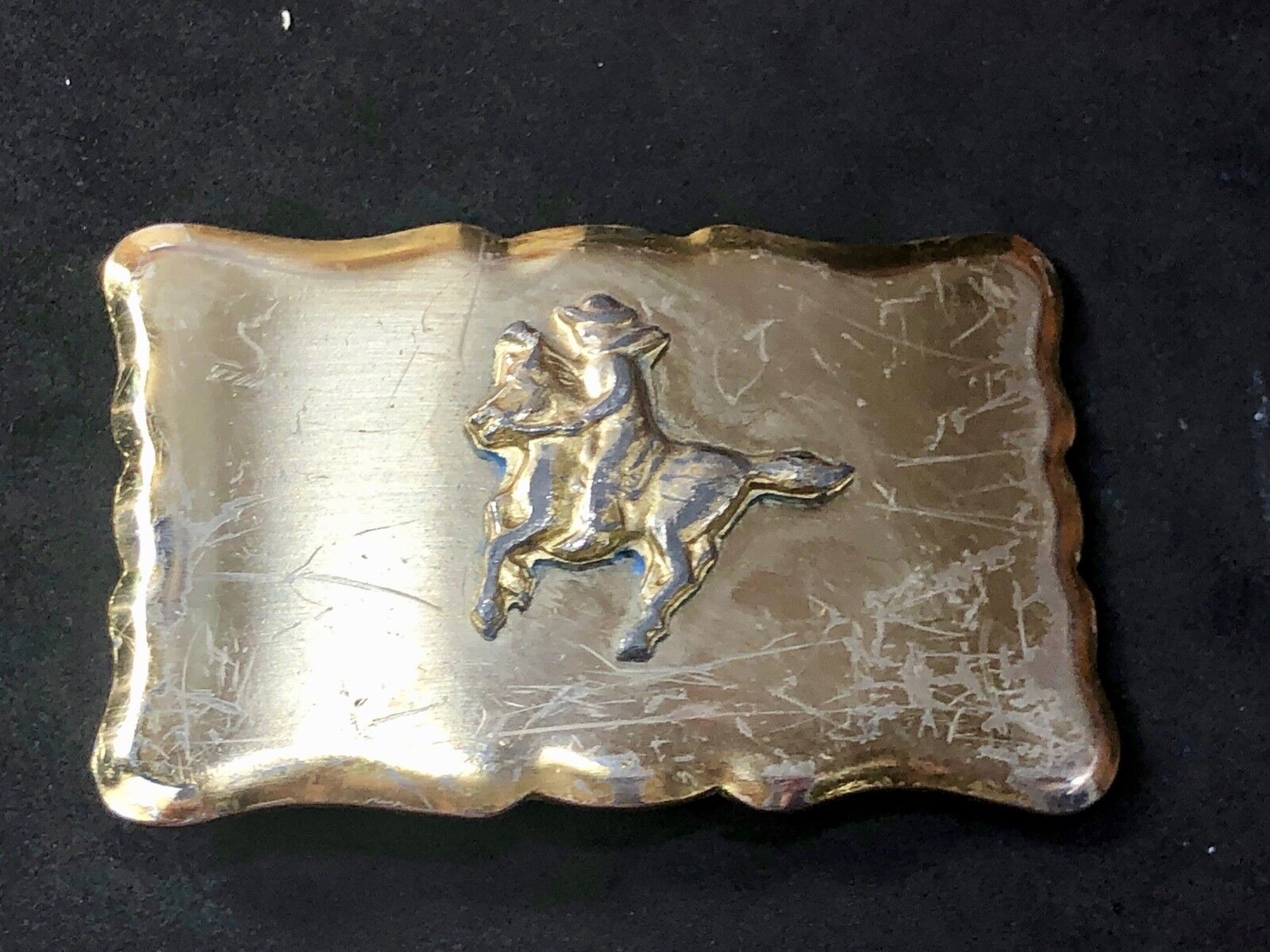 Vintage faceless cowboy on horse pony  riding the trail Western Belt Buckle 
