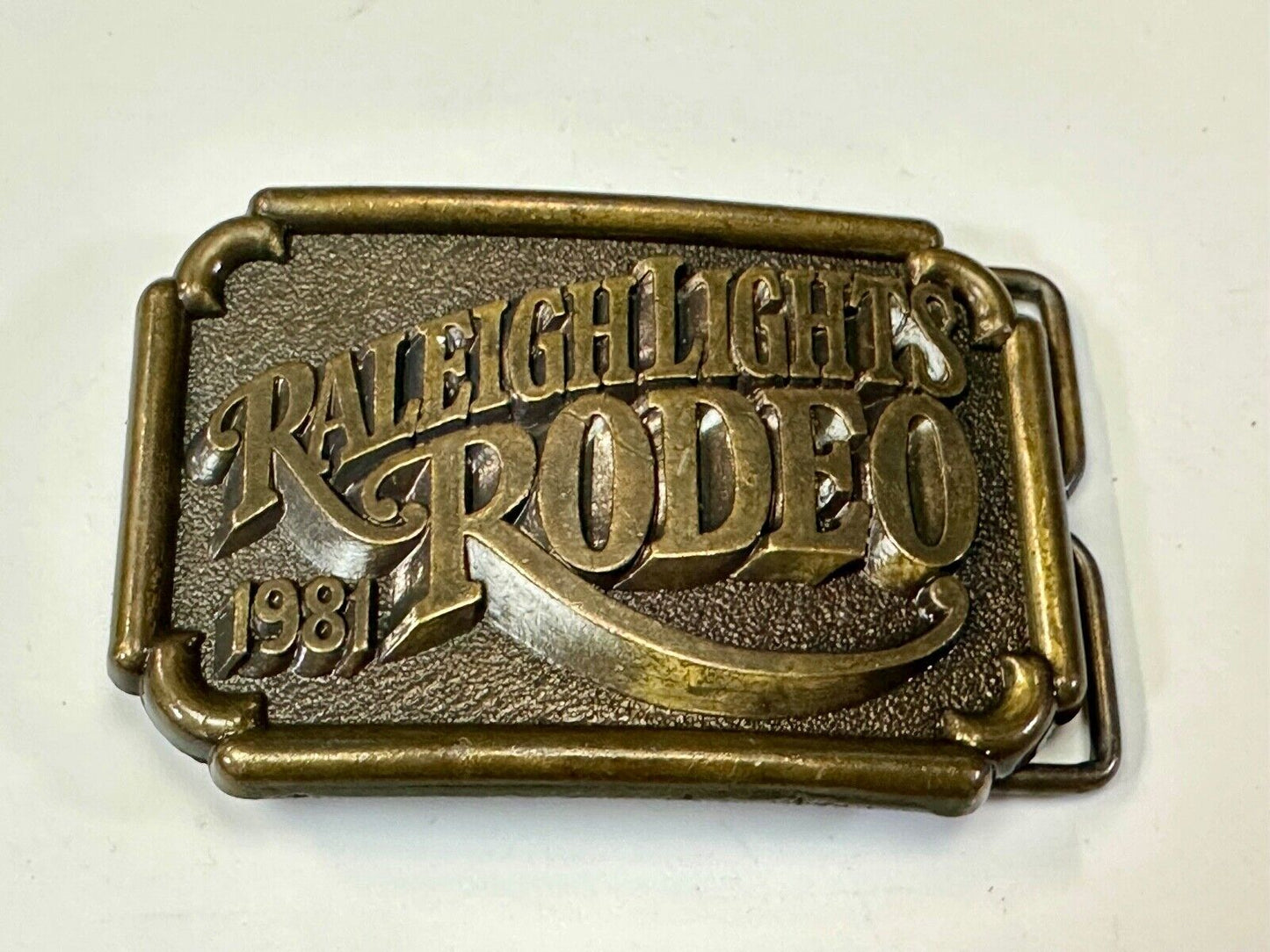 Vintage 1981 RALEIGH LIGHTS RODEO CIGARETTES SPONSOR Brass tone belt buckle