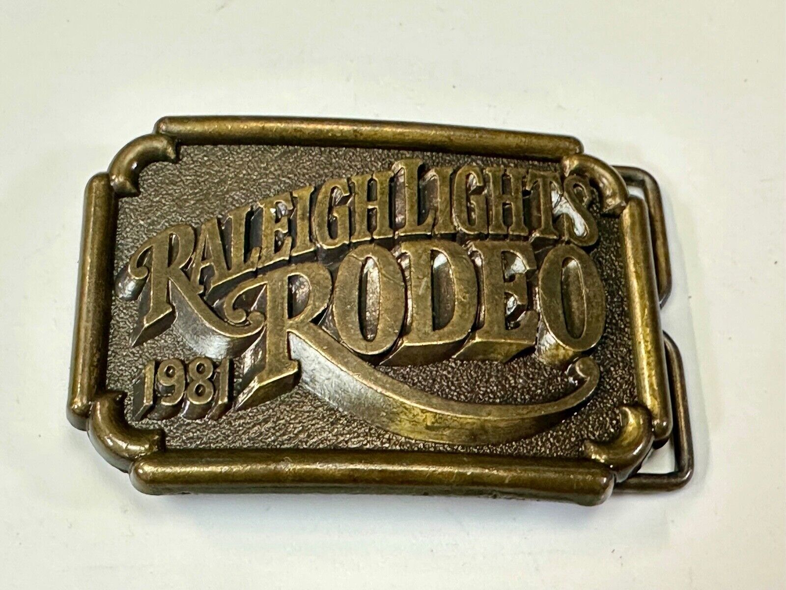 Vintage 1981 RALEIGH LIGHTS RODEO CIGARETTES SPONSOR Brass tone belt buckle