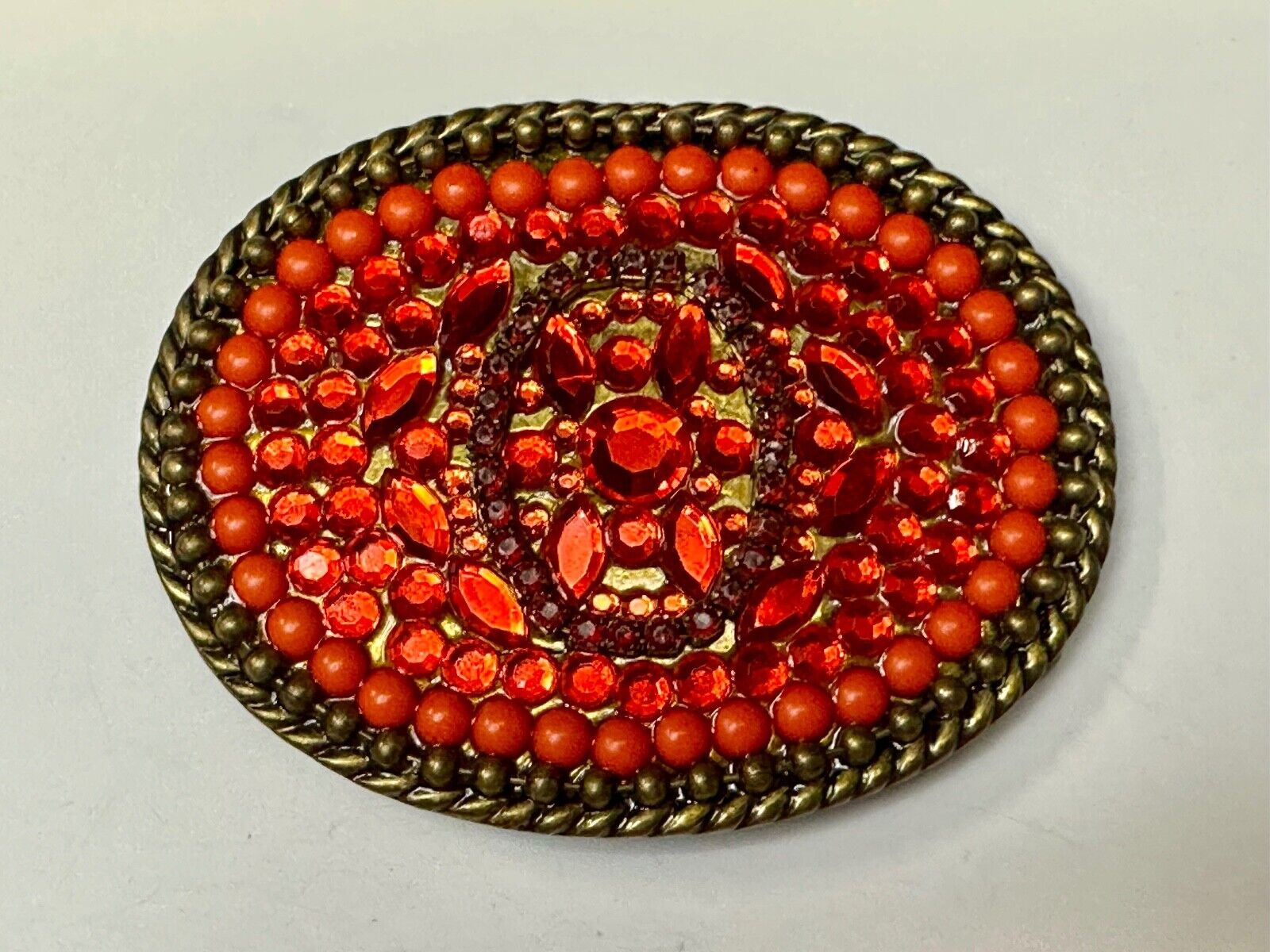 Unique Shades of Red - Mixed Materials oval outlined Belt Buckle