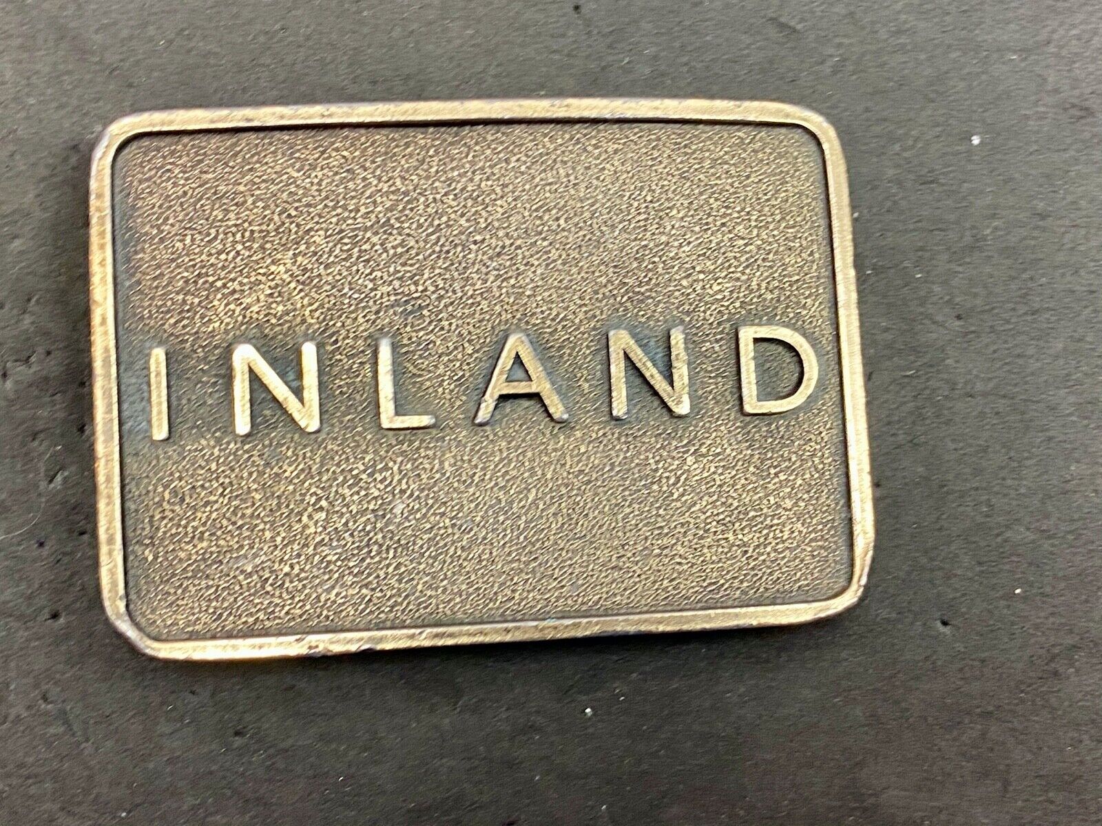 Vintage Inland company belt buckle - truck parts company 