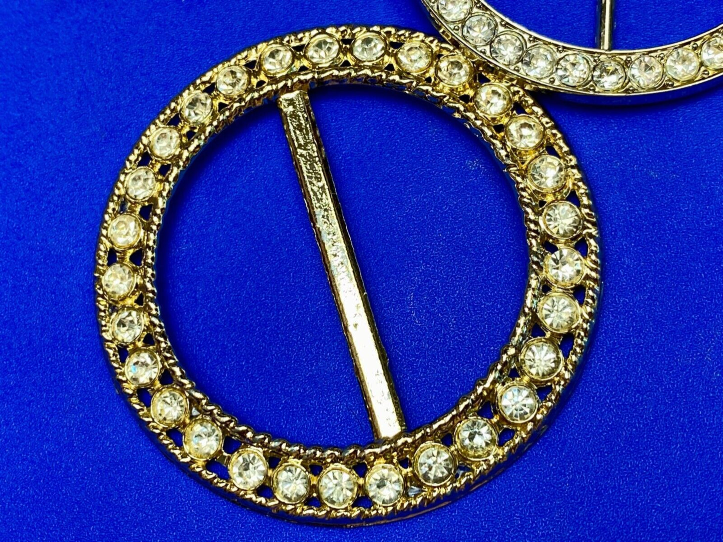 Two piece lot of antique Rhinestone covered round scarf slides