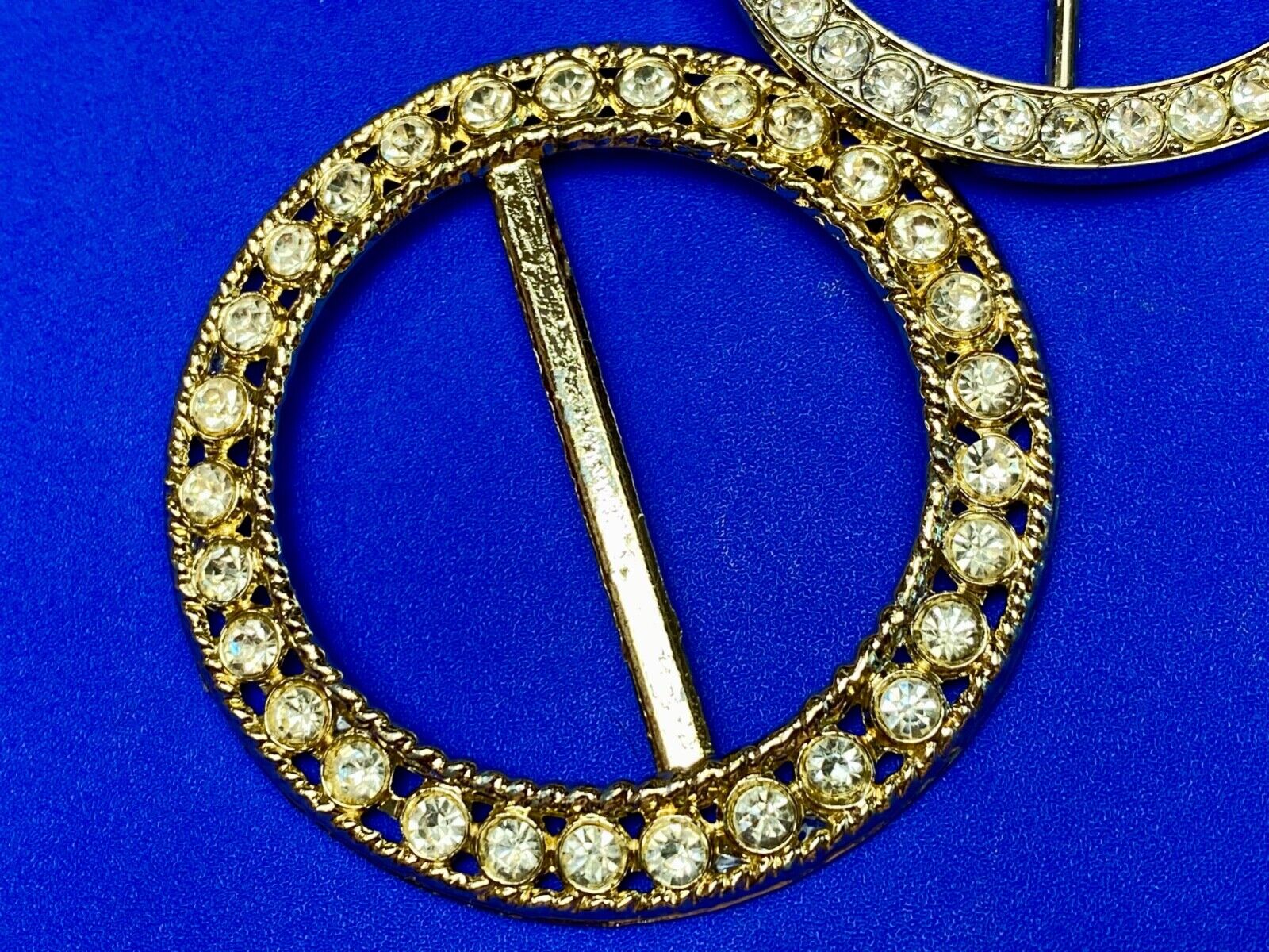 Two piece lot of antique Rhinestone covered round scarf slides