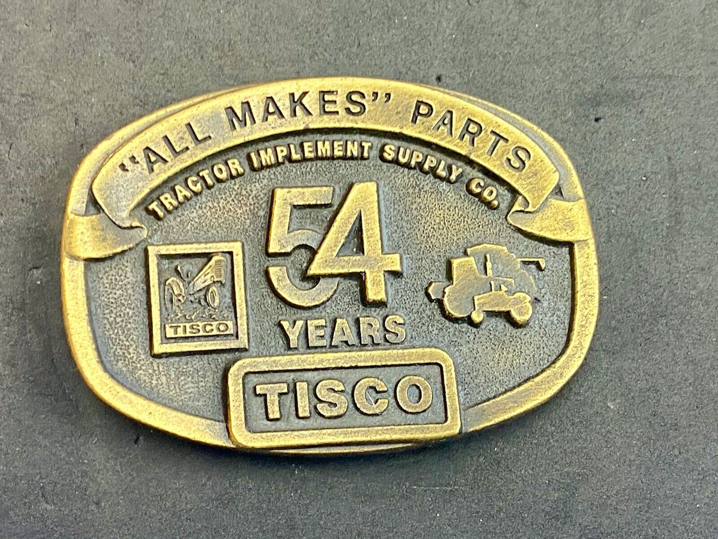 54 years Tisco Tractor Implement Supply Spec Cast Brass Belt Buckle series 2