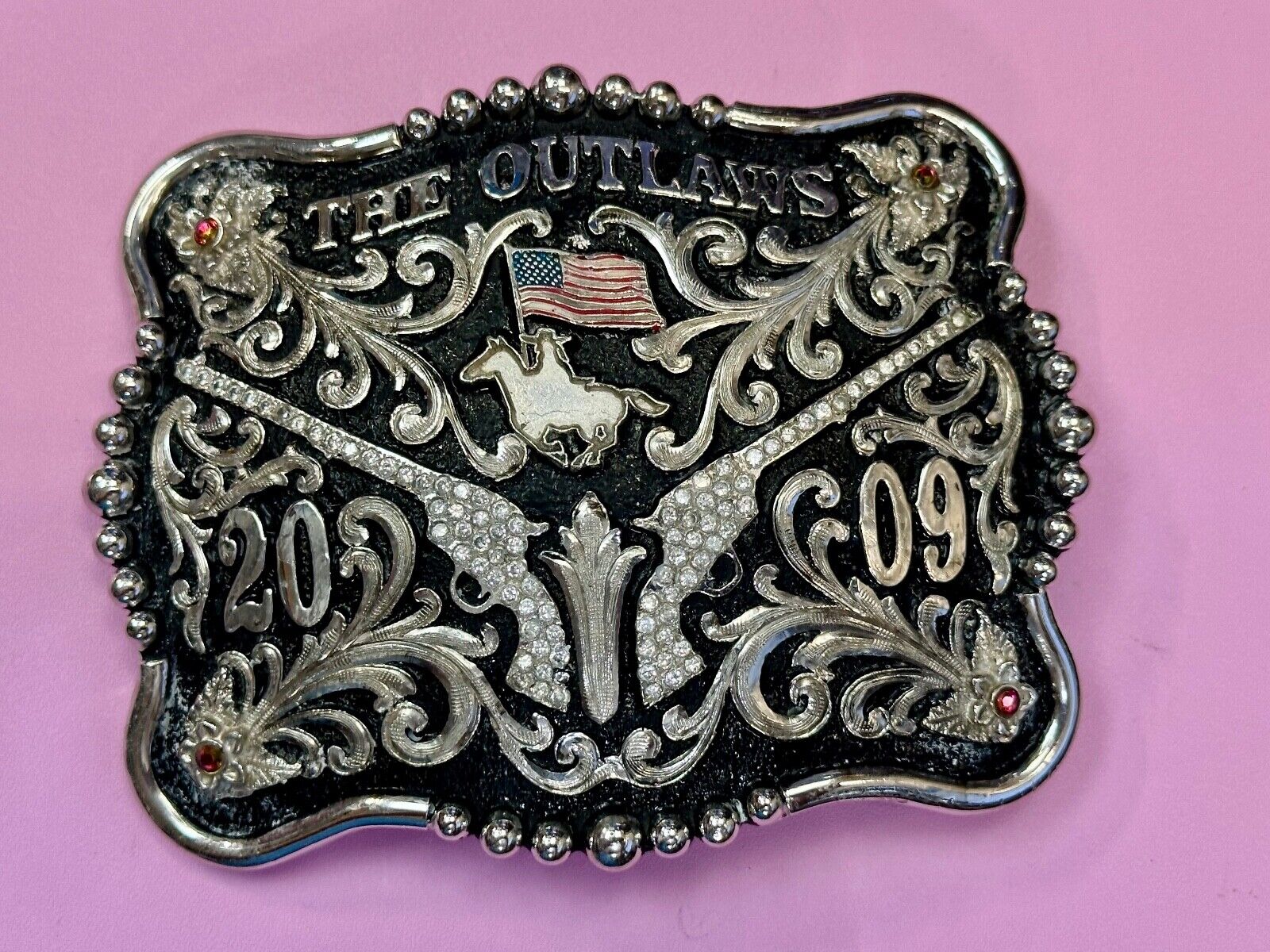 The Outlaws Rodeo Cowboy Trophy 2009 Flag Belt Buckle - Crossroads bucklesTexas