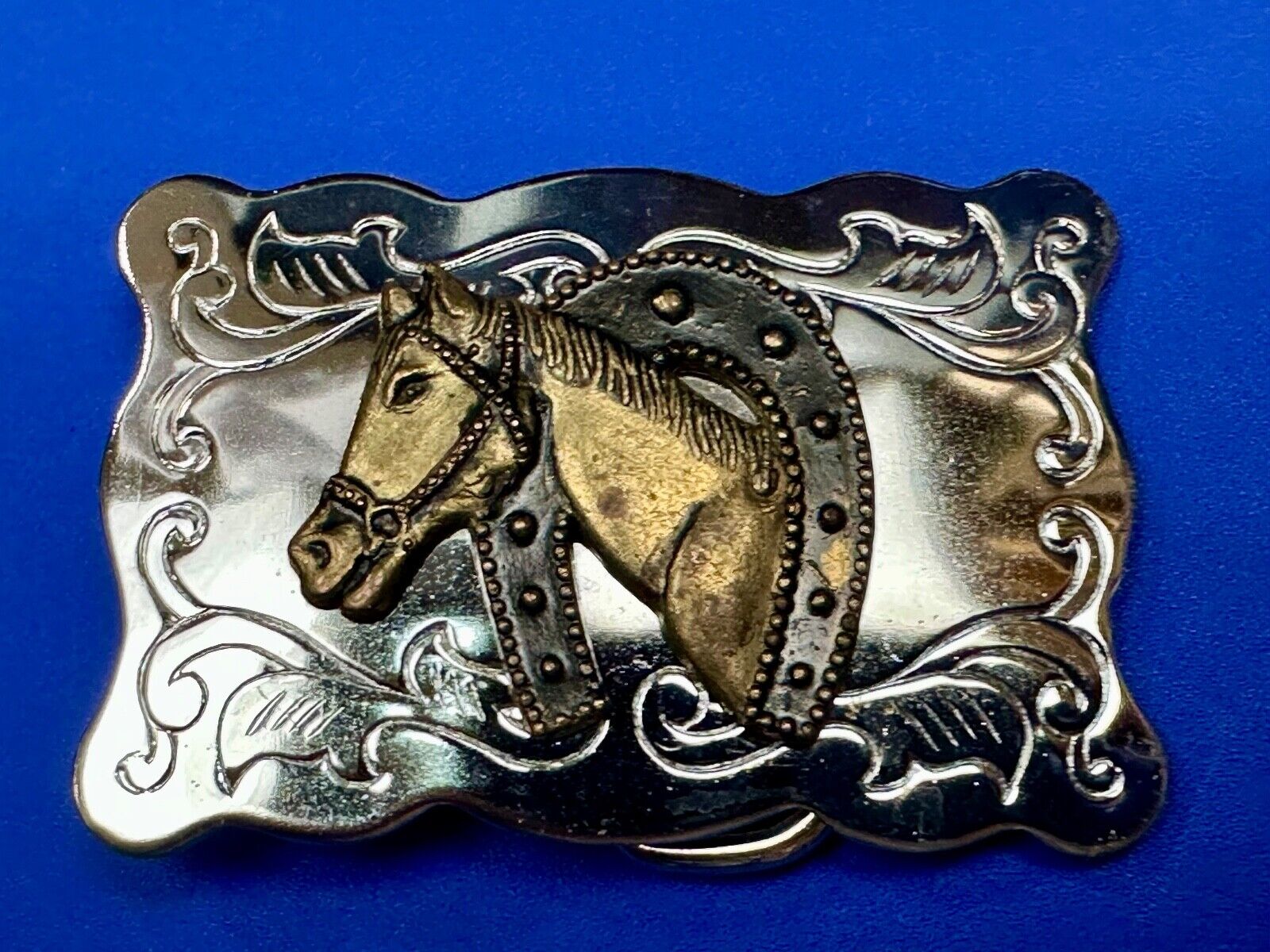 Vintage lucky horseshoe with head centerpiece on western two tone belt buckle