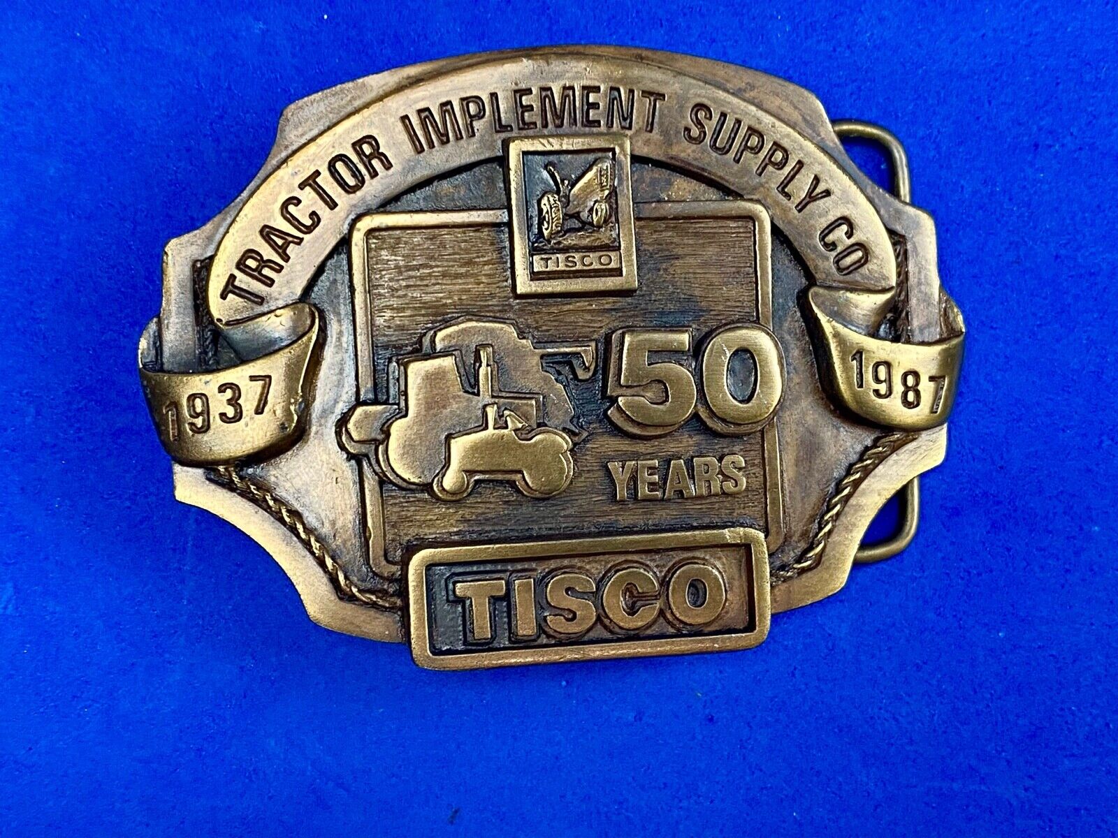 Vintage 1986 Tisco Tractor 50 years Anniversary Belt Buckle by Siskiyou 