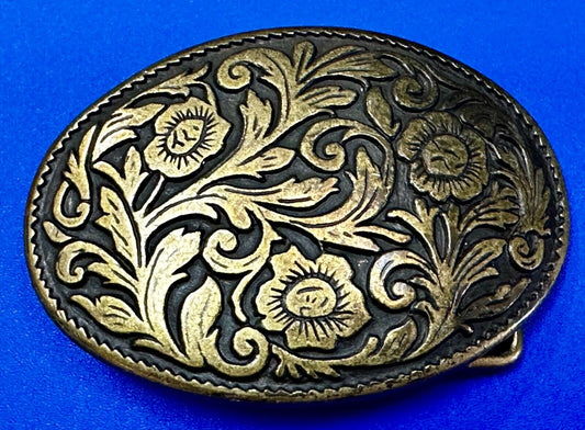 Vintage black and gold tone western flower floral theme cowboys belt buckle