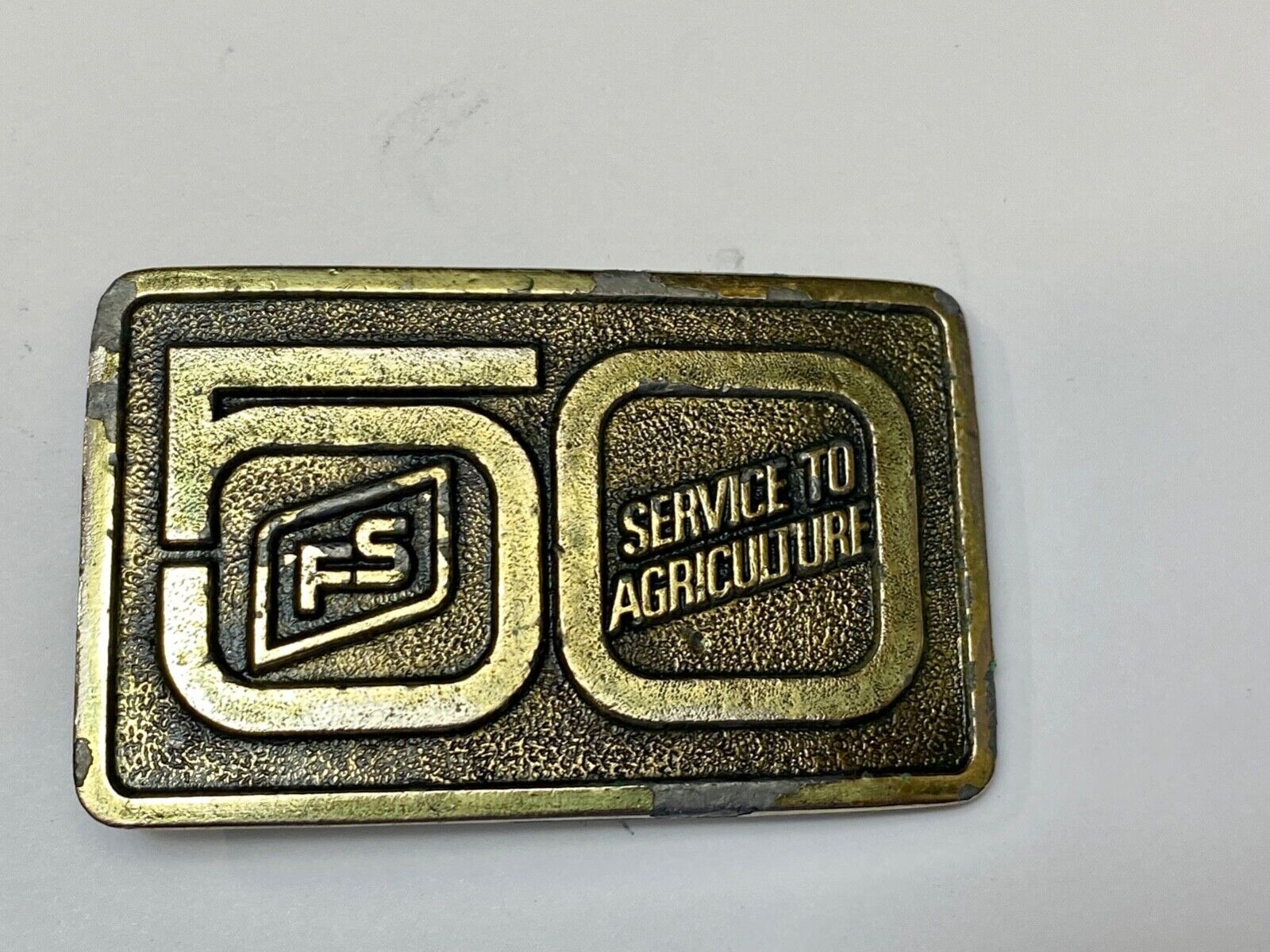 50 years, Farm Service to Agriculture belt buckle by Wyoming Studio Art works