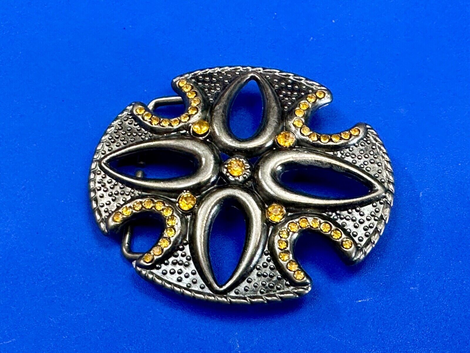 unique see through iron cross with golden brown rhinestone accents