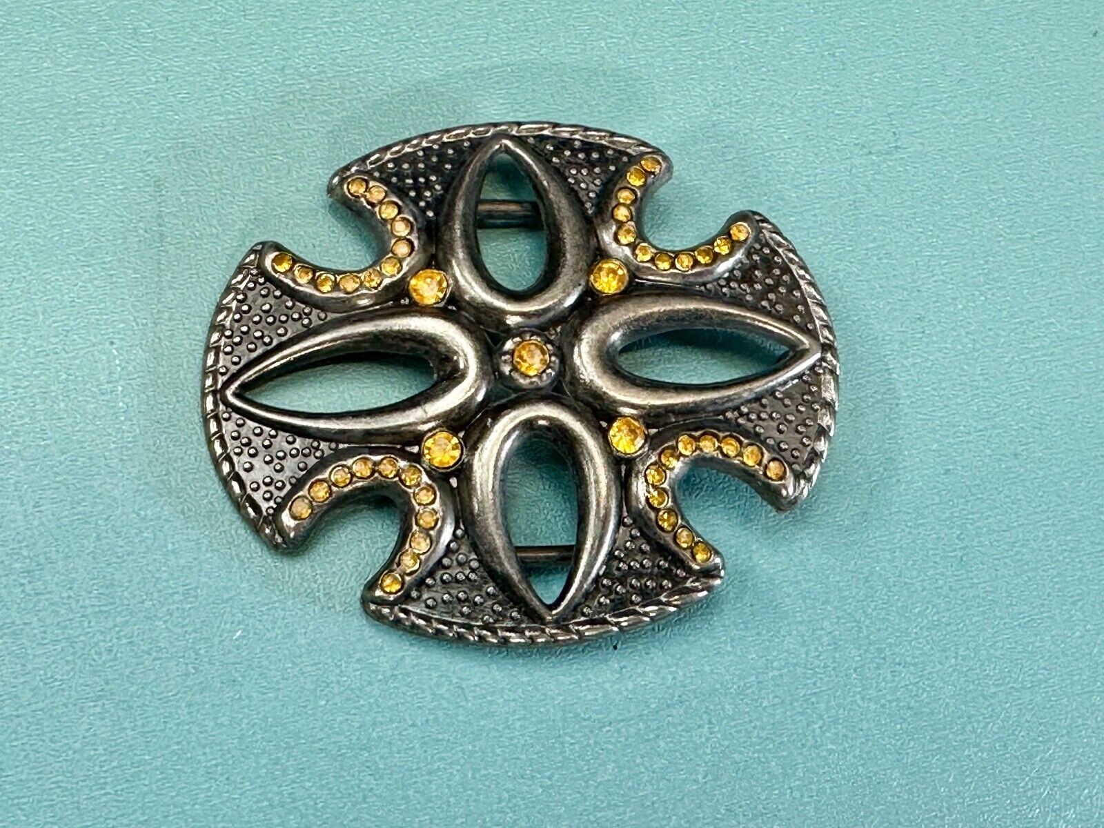 unique see through iron cross with golden brown rhinestone accents