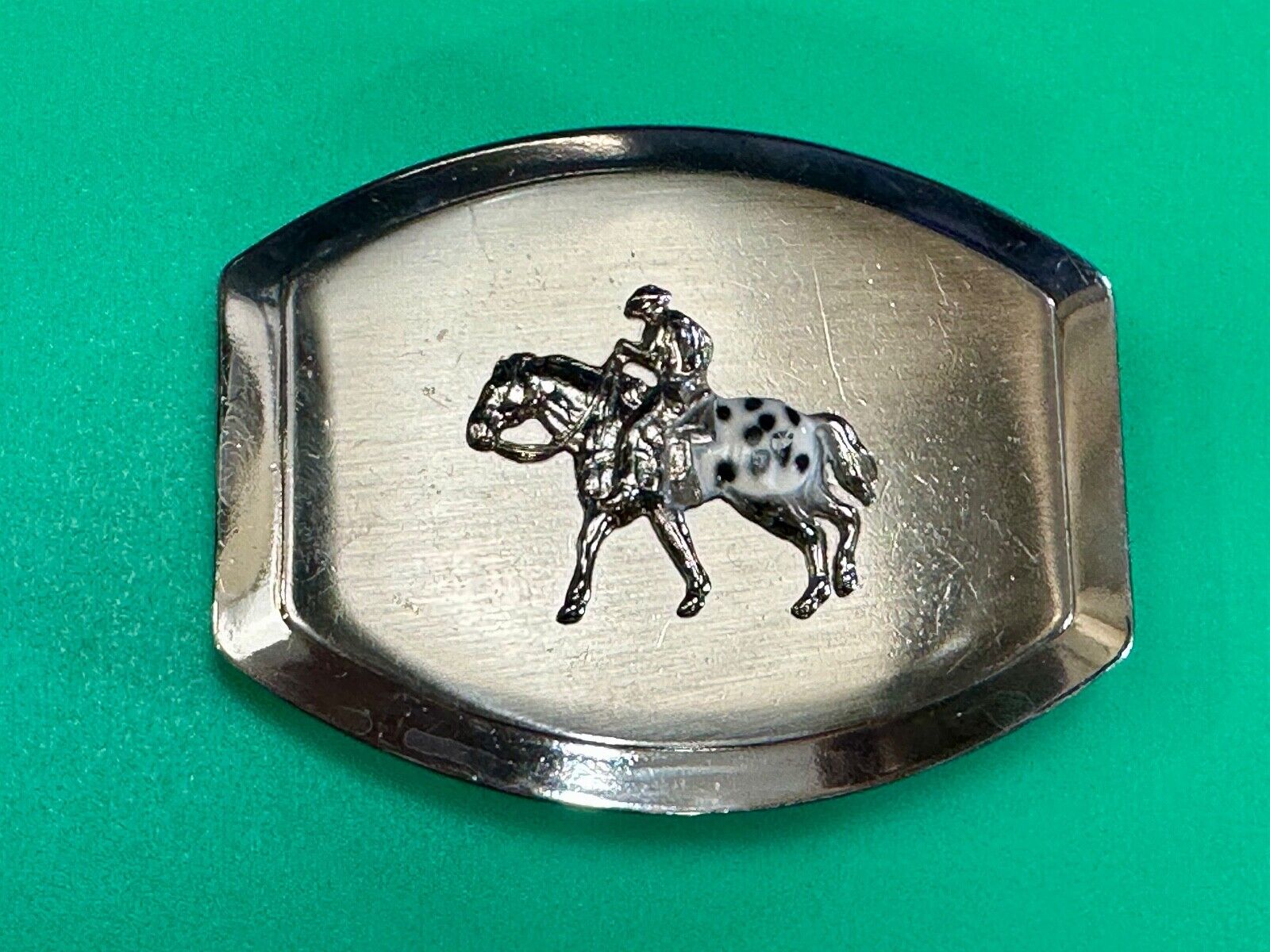 Vintage Horseback Riders cowboys belt buckle with black & white enamel accents