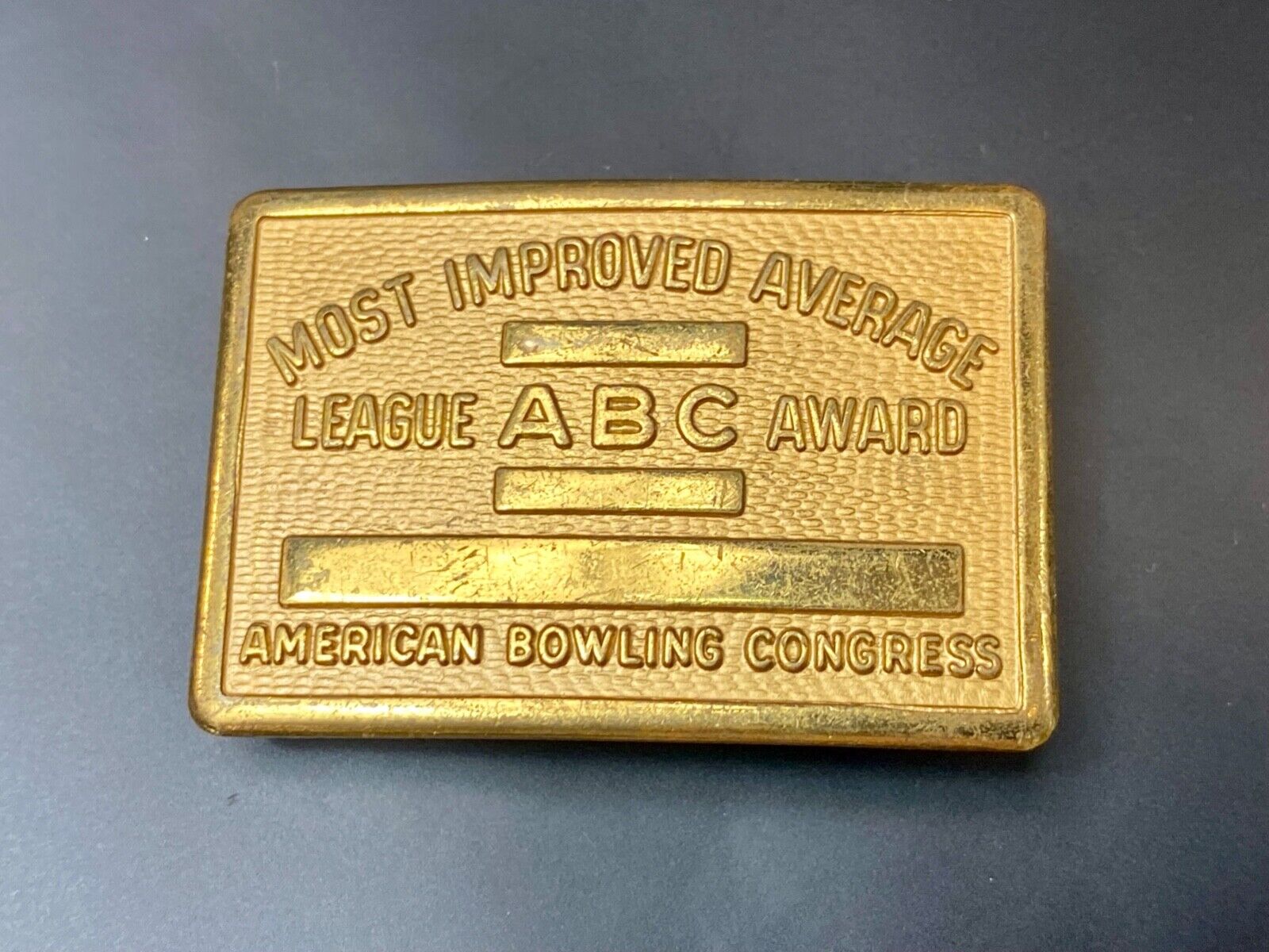 AMERICAN BOWLING CONGRESS MOST IMPROVED AVERAGE AWARD BELT BUCKLE BLANK RIBBON