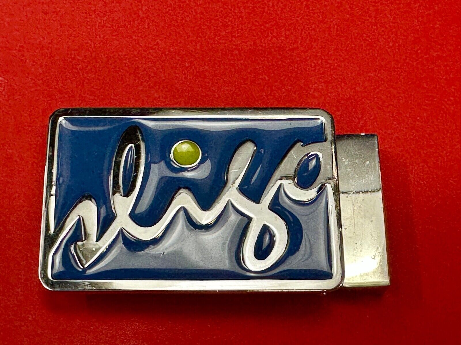 unknown to me!   Sligo Sugowear blue colored emblem or logo belt buckle