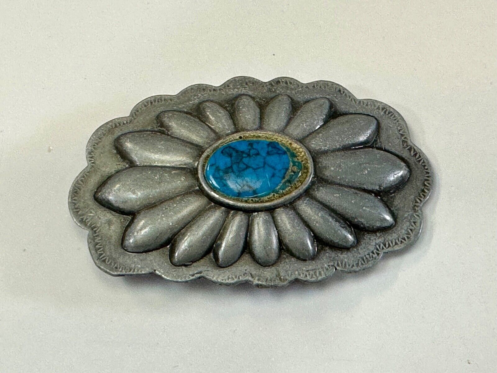 Turquoise stone centered on Vintage metal flower theme belt buckle