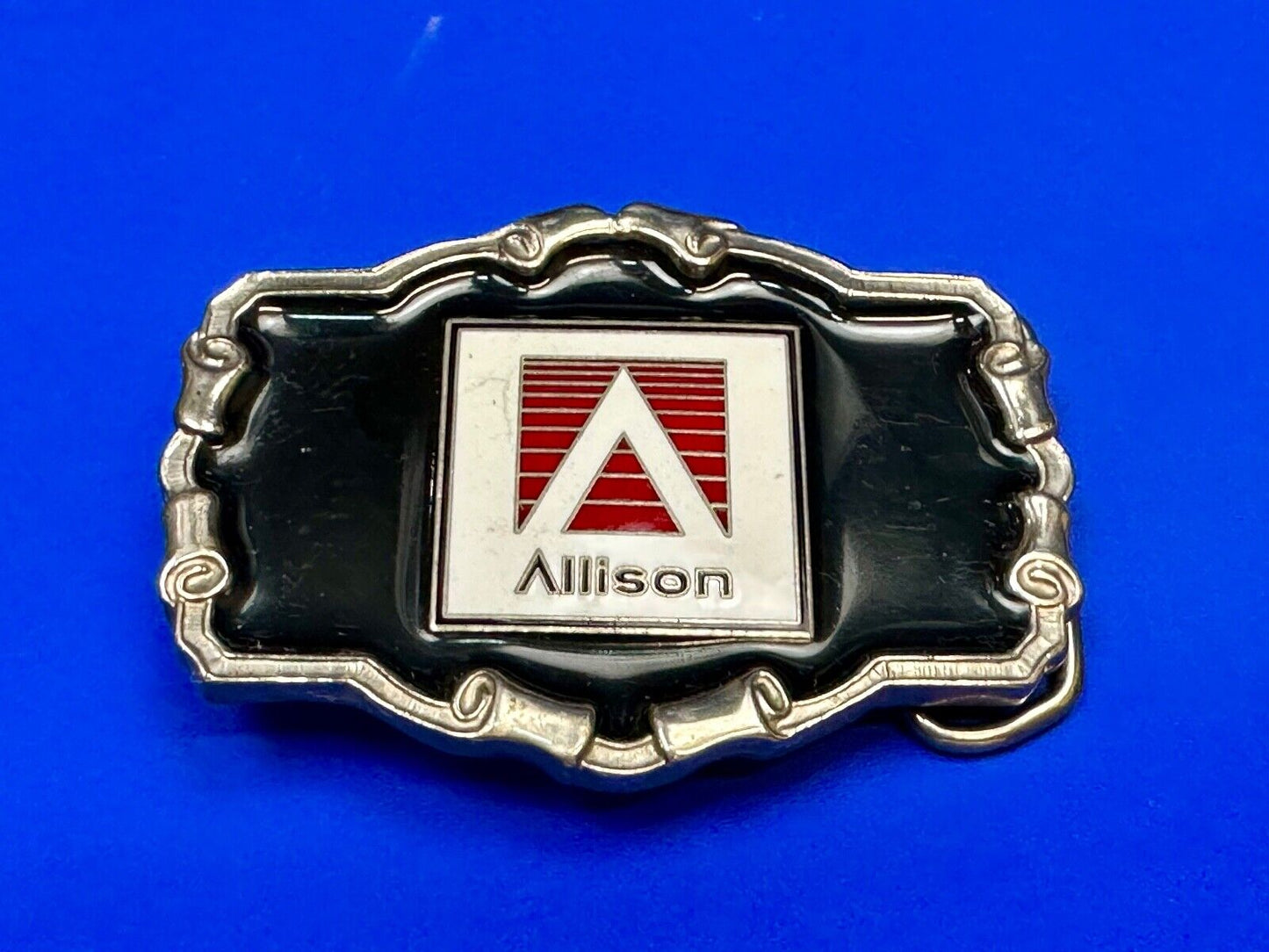 Allison Company logo emblem on western framed black enameled belt buckle