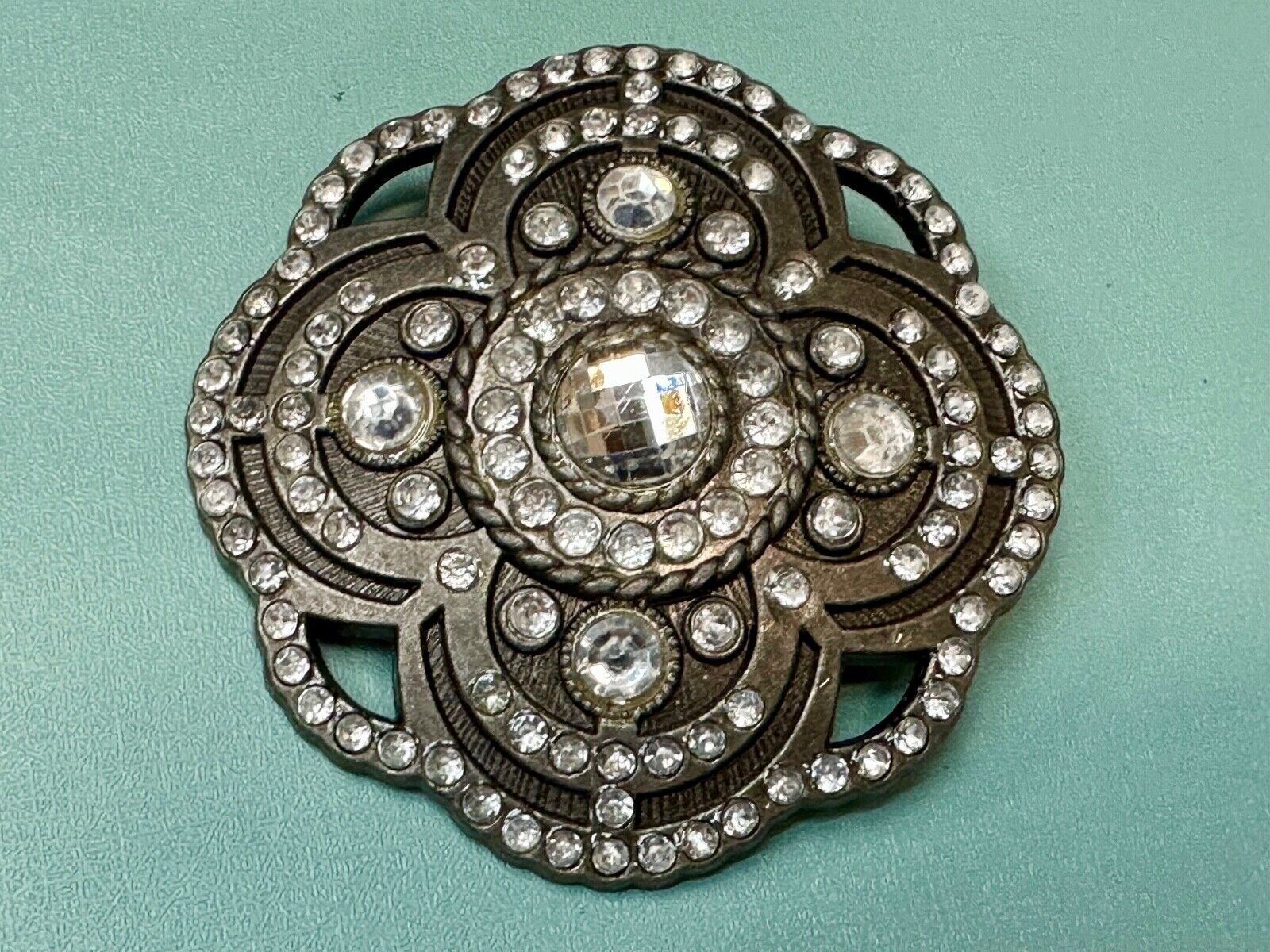 Beautiful Rhinestone accented see through flower shaped cutout belt buckle