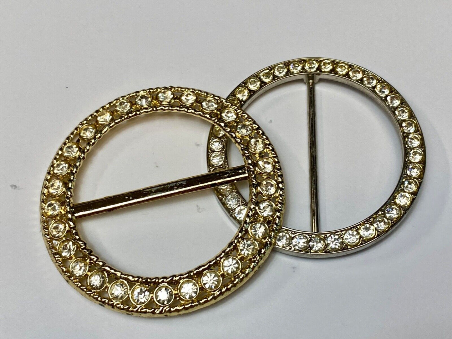 Two piece lot of antique Rhinestone covered round scarf slides