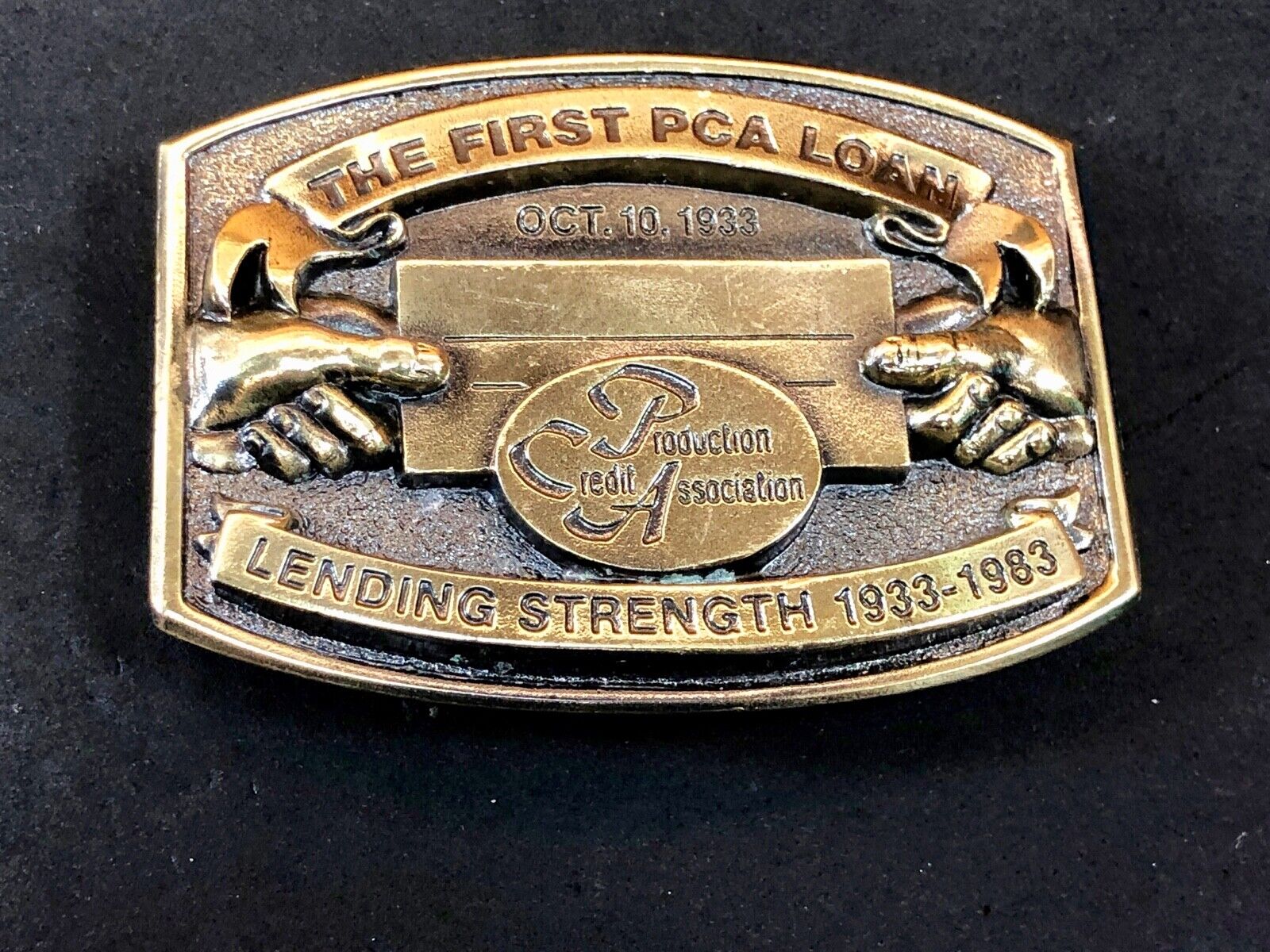 The first PCA loan belt buckle - Lending and strength  production credit assn.