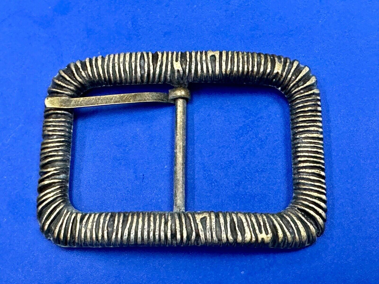 Unique Center Bar Spring abstracted wrapped style rectangular belt buckle