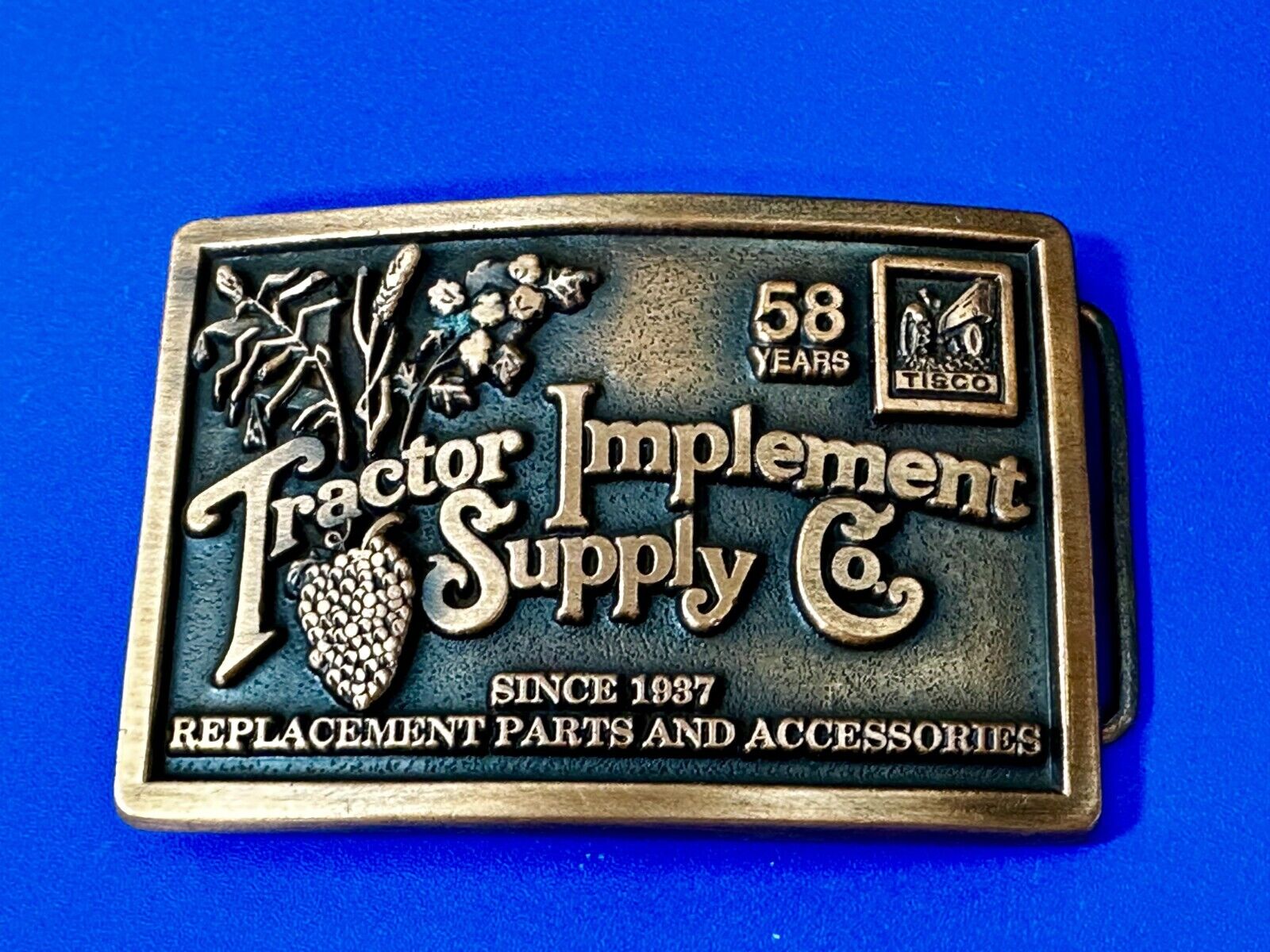 TISCO 58 Years Tractor Implement Supply Co. Since 1937 Belt Buckle by Spec-Cast