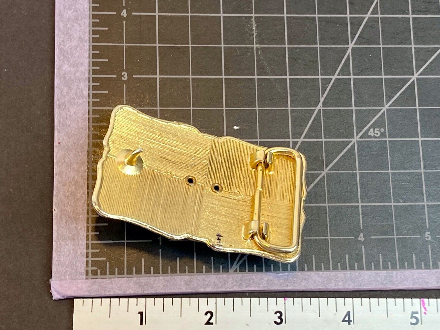 unknown multi layered colored stone as centerpiece in western belt buckle