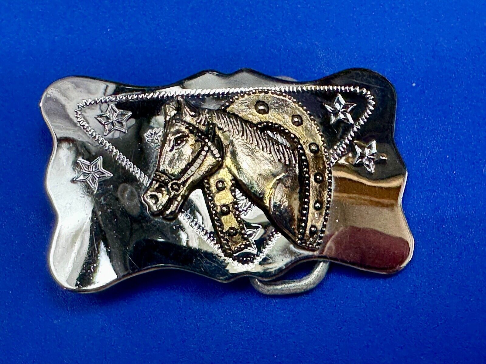 Vintage horse head through lucky horseshoe on reflective western belt buckle