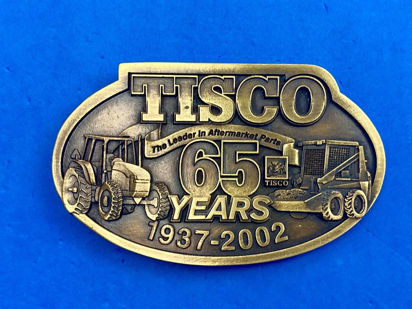 65 years - Tisco Tractor Implement Supply Spec Cast Farming Belt Buckle 
