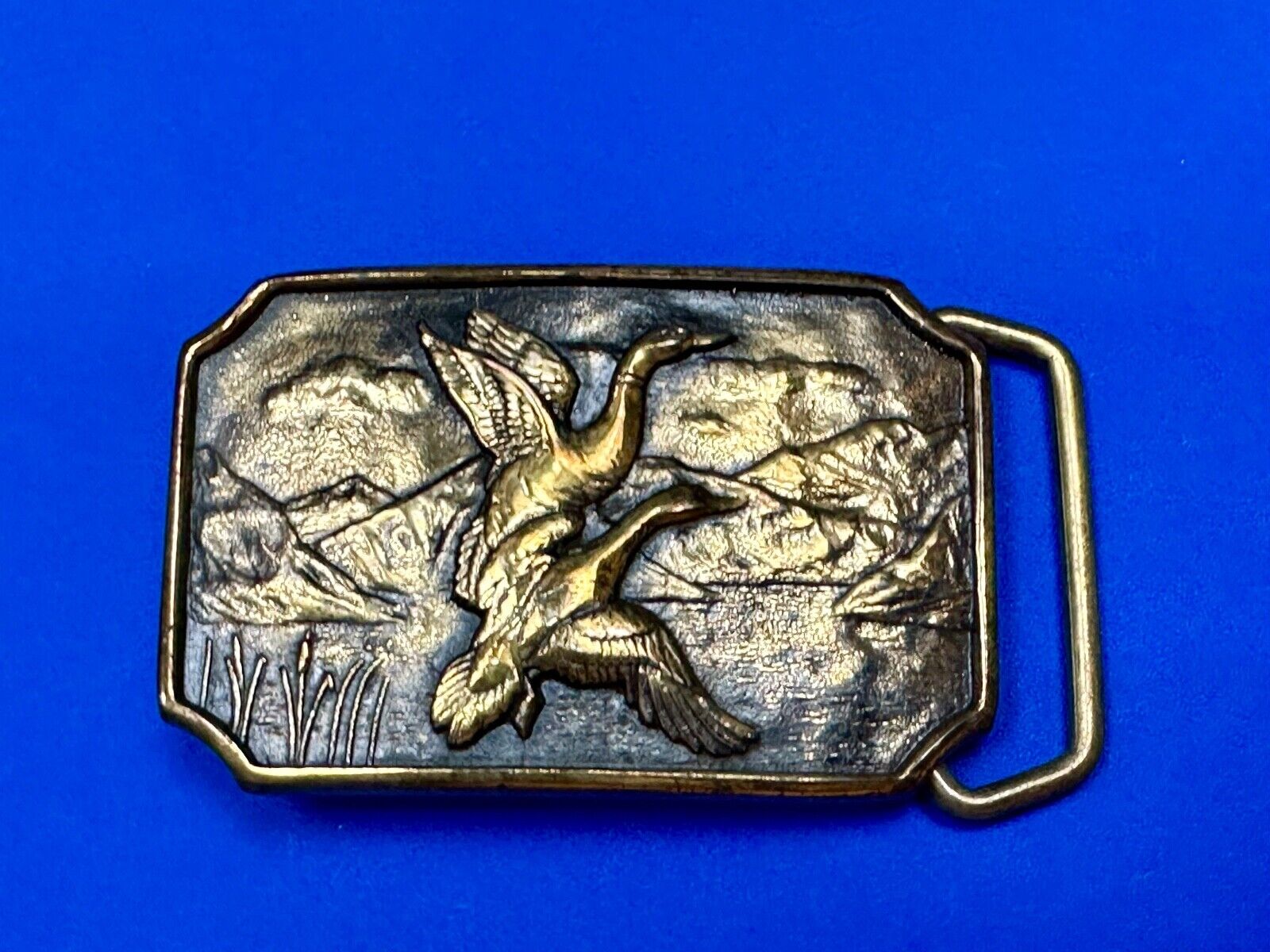 Two ducks flying from pond cat tails Nature Solid Brass belt buckle by BTS