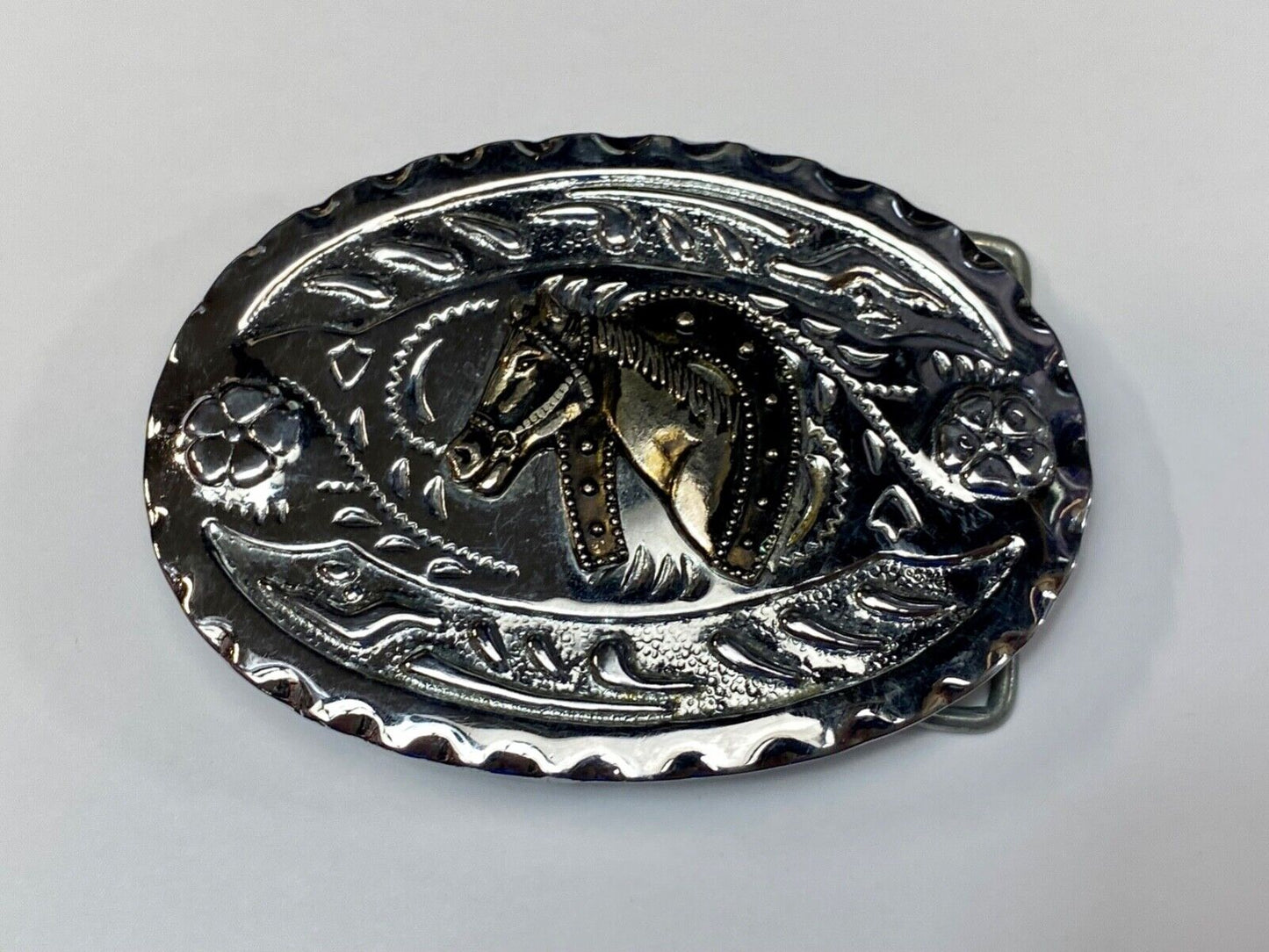 Vintage horse head through lucky horseshoe on mixed metal western belt buckle