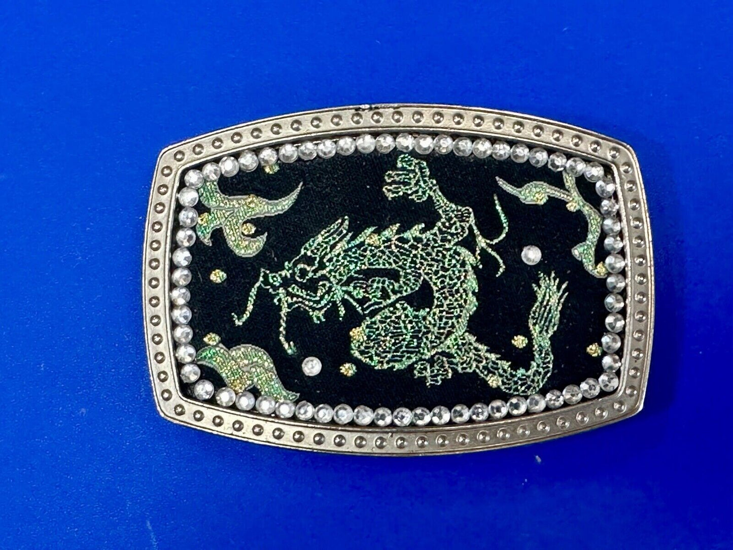 Chinese Dragon pattern symbol on silver tone rhinestone accented belt buckle