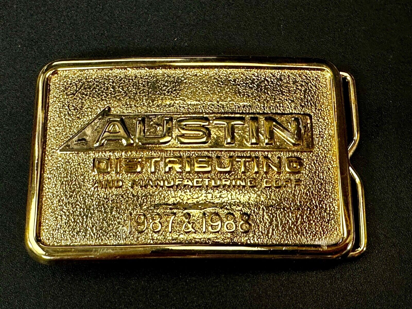 Austin Texas Distributing and Manufacturing 1987 - 1988 Gold Tone Belt Buckle